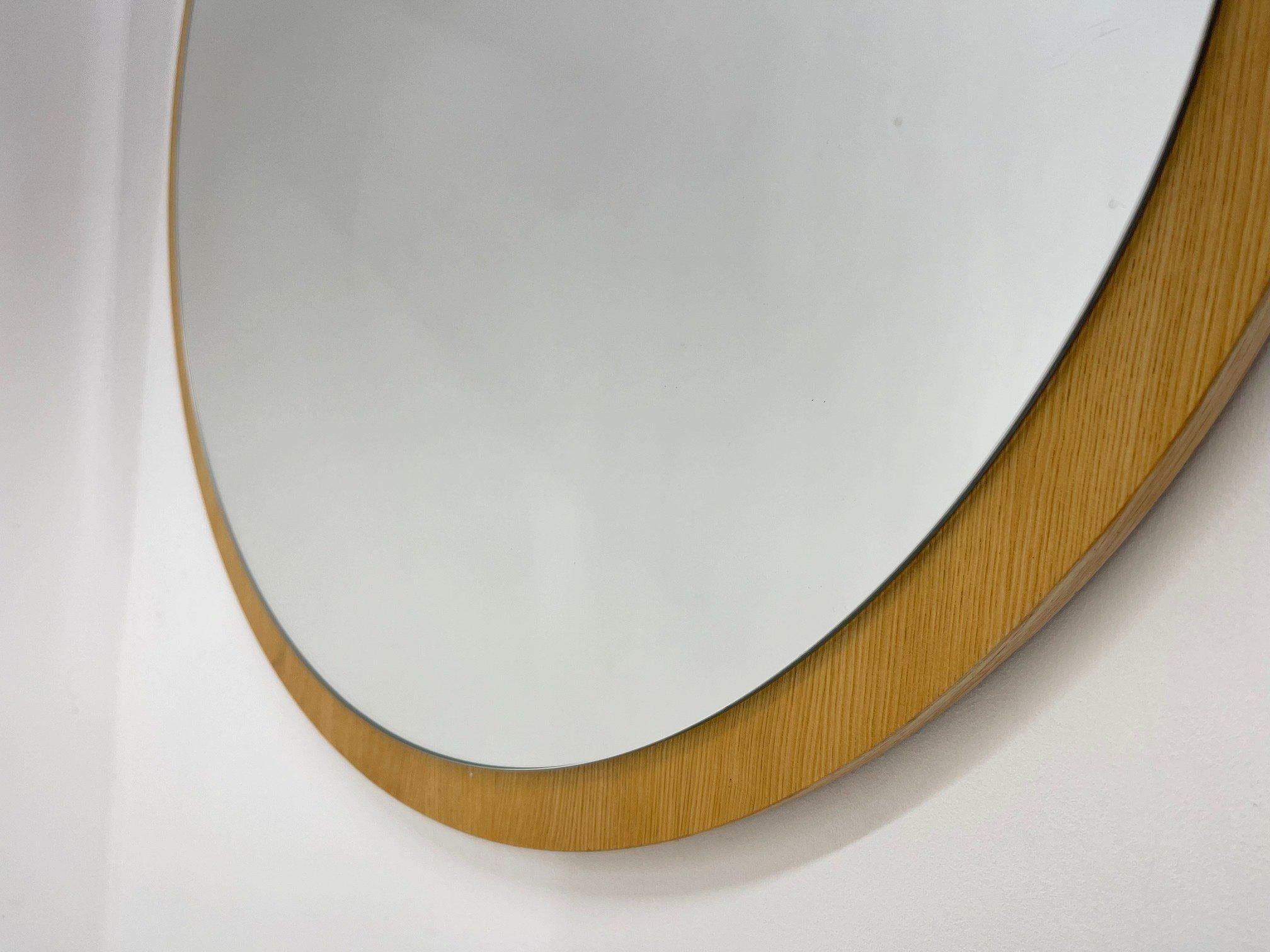 Vintage round wall mirror on wooden base from Czechoslovakia, made in the 1970's.