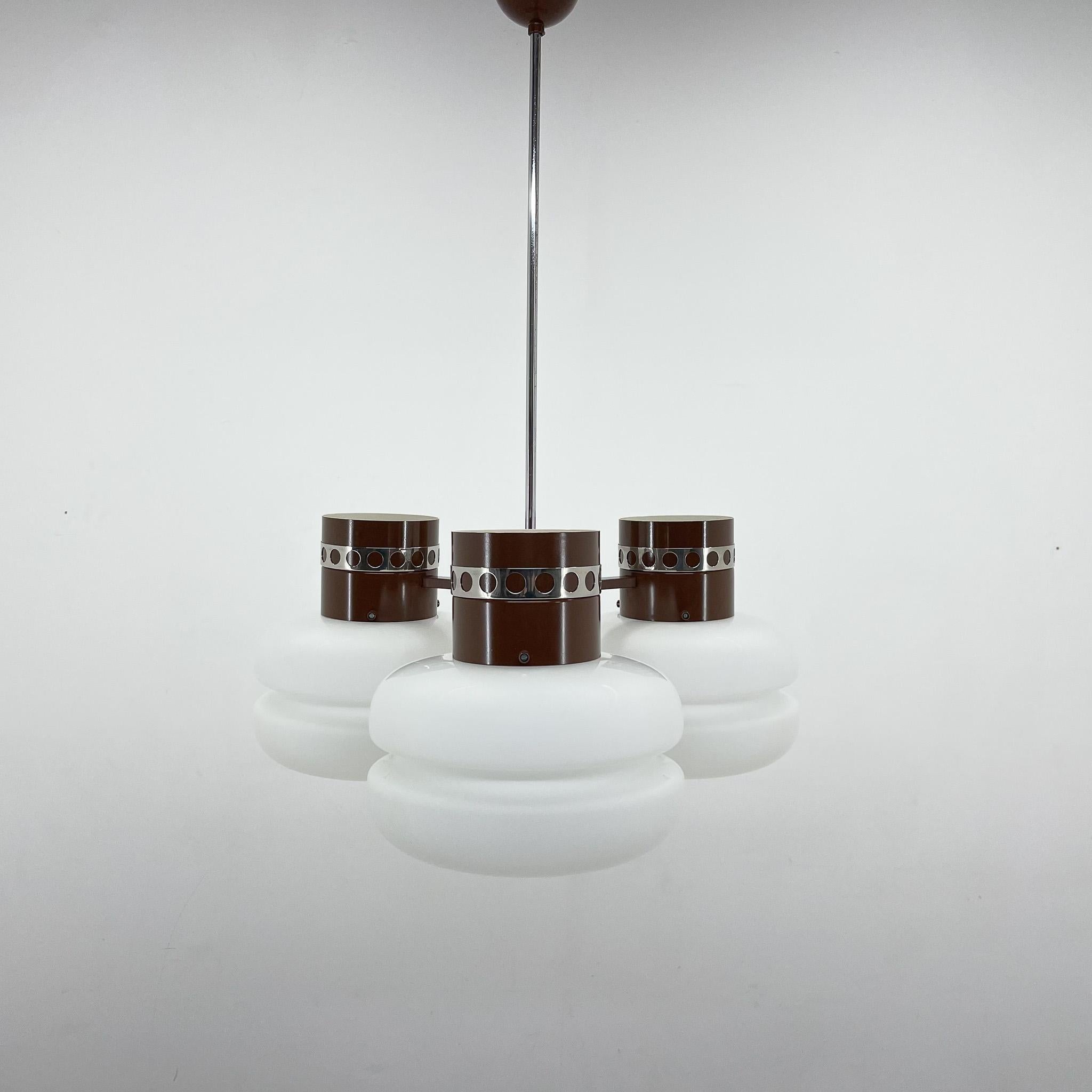 Mid-century, heavy chandelier by the famous Napako. Produced in Czechoslovakia in the 1970's. Made of milk glass, laqueered metal and chrome decor. Bulb: 3 x E25-E27.