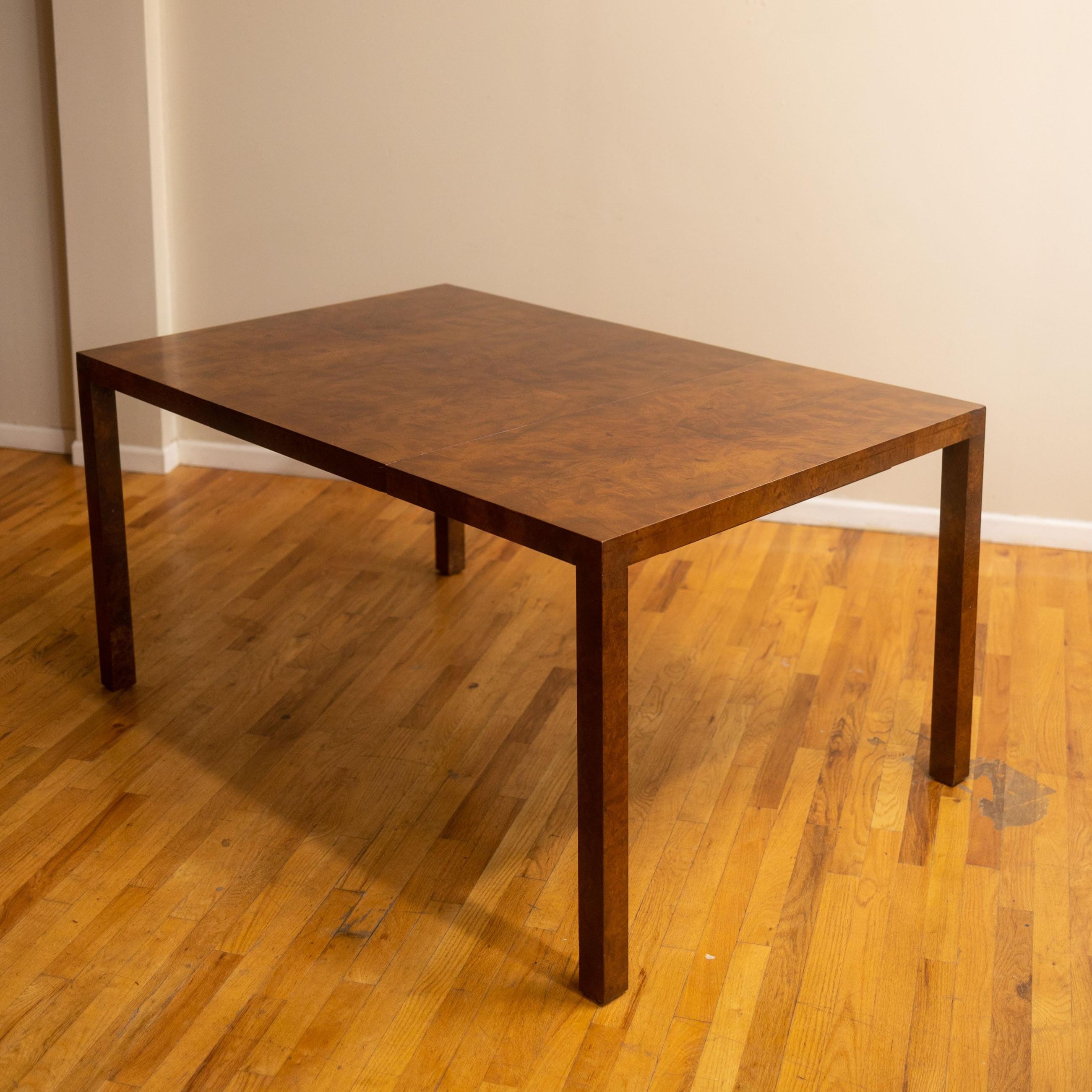 c. 1970s w/ four leaves, original tags, brass clasps, and a drop-down leg that makes this table incredibly steady even when fully extended. Each leaf adds 21