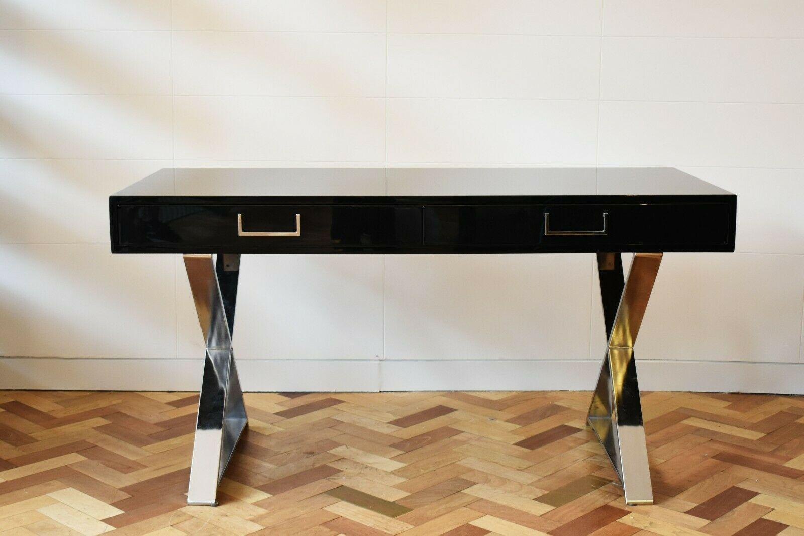 A 1970's campaign desk designed by Milo Baughman and produced by Thayer Coggin.

It's elegant simplicity makes it a versatile and beautiful addition to any room as a console, writing table/desk or a dressing table. It's black lacquer finish