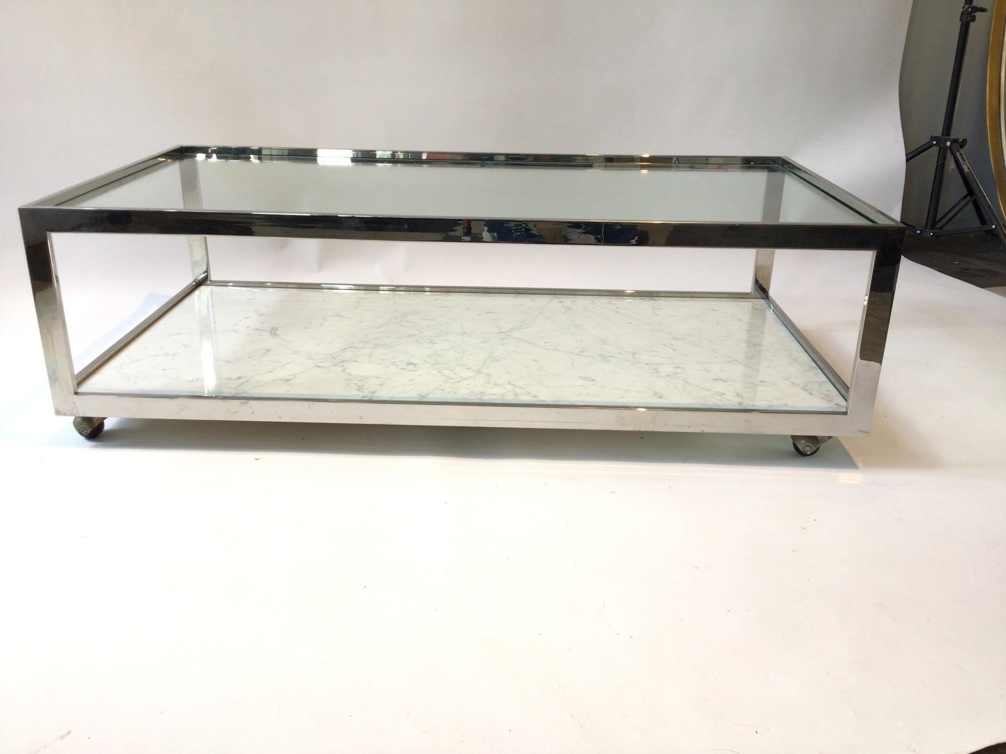 1970s Milo Baughman chrome, glass, and marble coffee table on wheels.