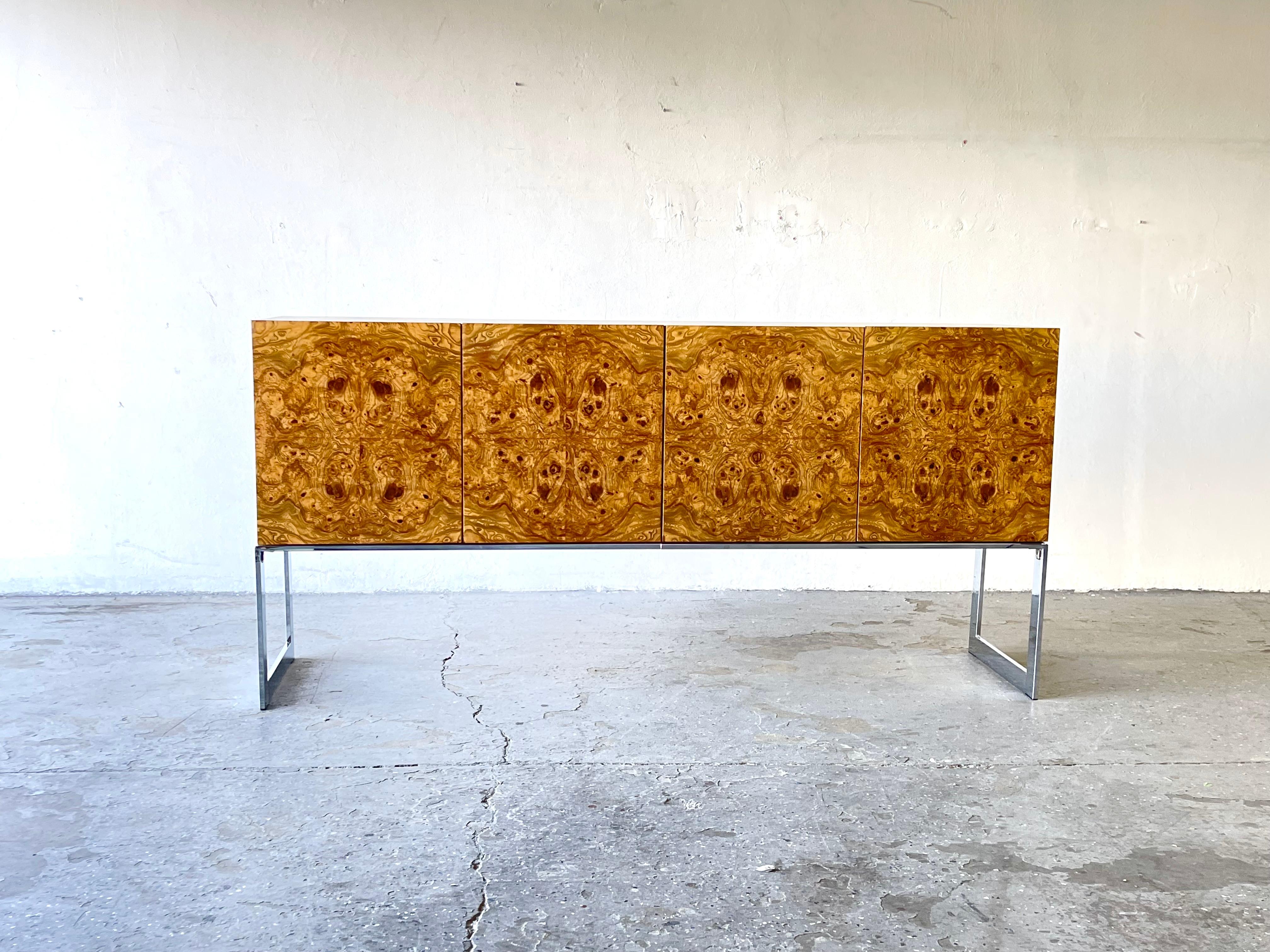 Beautiful vintage matched burl wood and chrome credenza by Milo Bughman for Thayer Coggin in United States, circa 1970s. This exceptional credenza stands out for the fine finishes, showing elegant and detailed figures in each of its angles. A