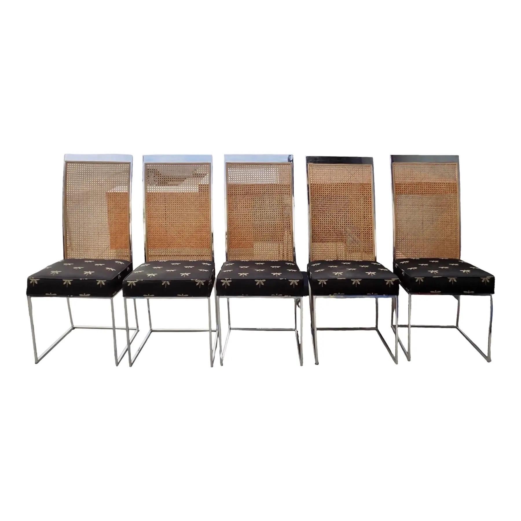 A set of five Milo Baughman for Thayer Coggin dining chairs. Square caned seat backs are framed in chrome plated steel, square seats are upholstered in black fabric embroidered with dragonflies. Legs are supported with an open box stretcher at the