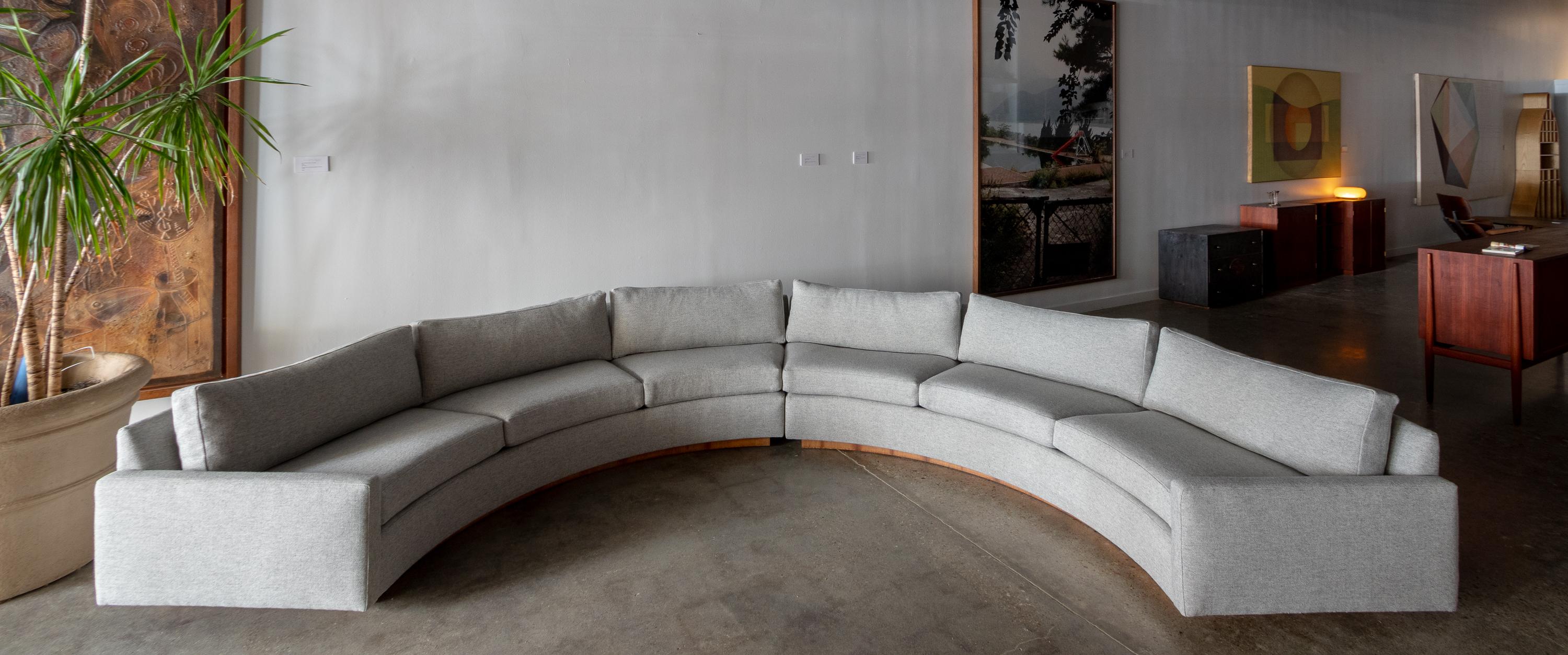 A 1970s Milo Baughman for Thayer Coggin two piece semi circular sofa with new Maharam Hallingdal fabric on a rosewood veneered plinth base. This example is a statement piece at 13.5 ft wide and 7ft deep.  Perfect for entertaining all your guests. 