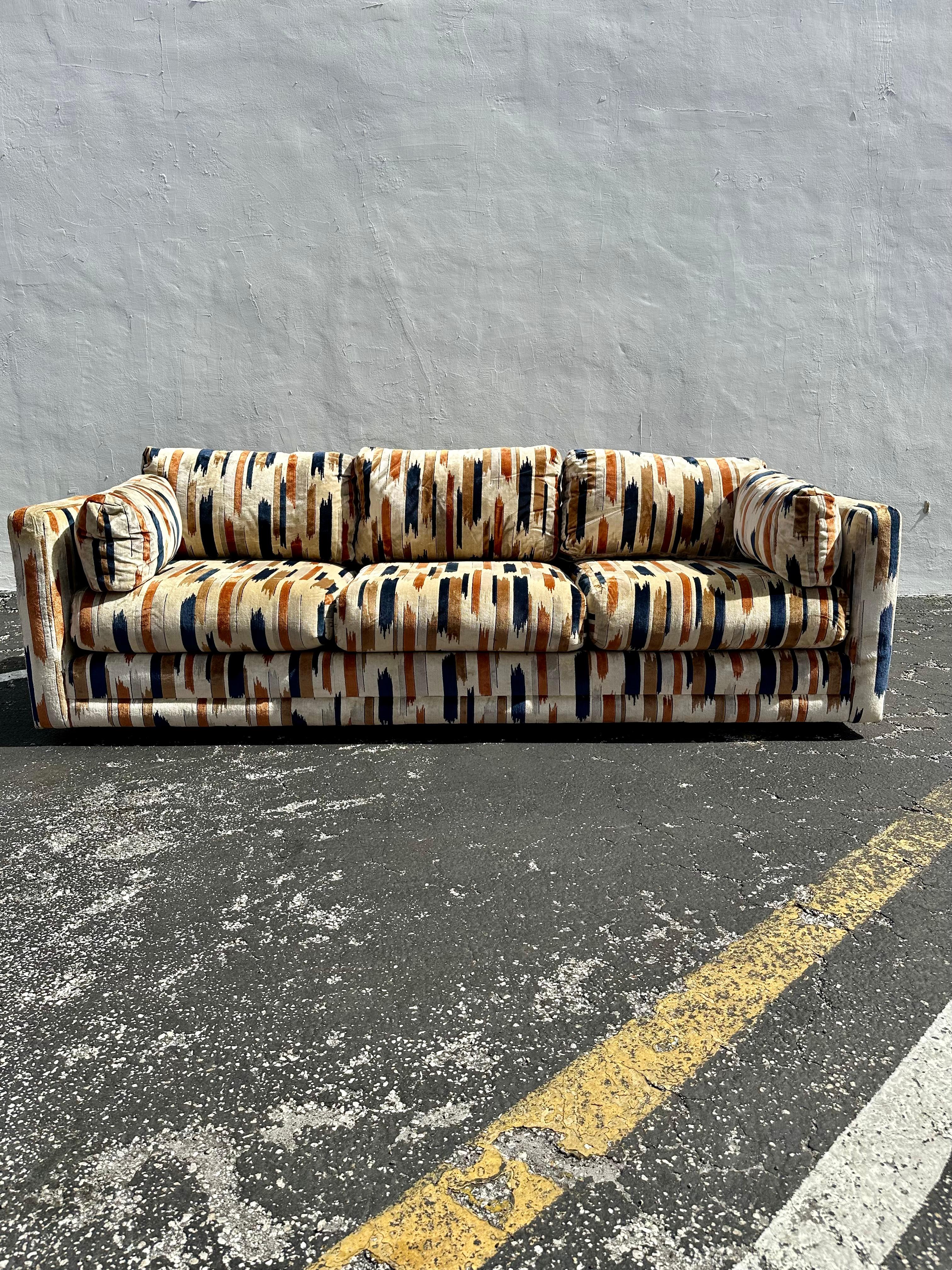 On offer on this occasion is one of the most desirable Baughman/Larsen, cotton velvet, tuexedo sofa you could hope to find. In colorations of navy blue, brown and beige. This is an ultra-rare opportunity to acquire what is the most spectacular and