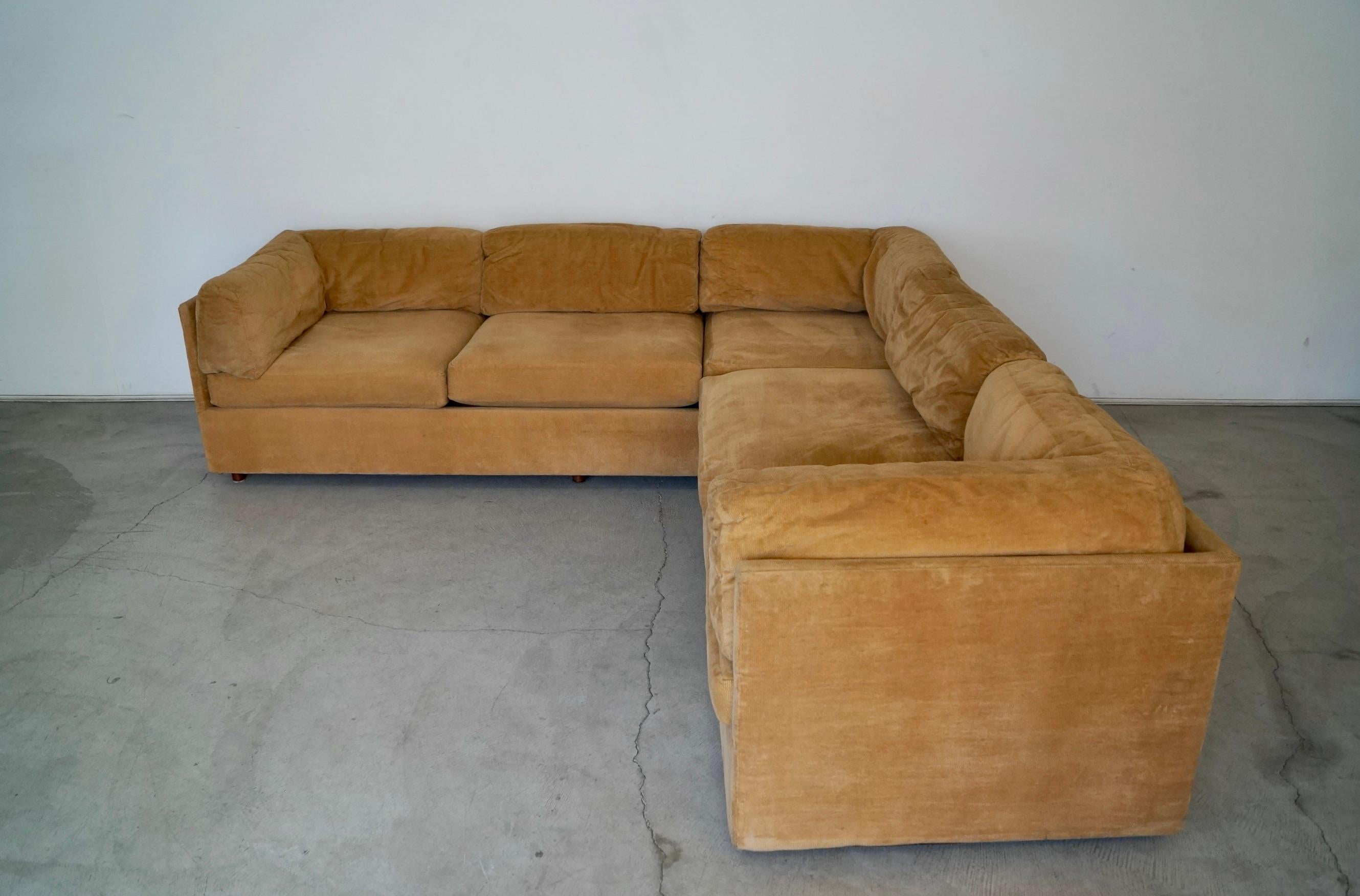 Vintage original 1970s Mid-Century Modern lounge couch for sale. It comes with three pieces, and is a sectional with one long sofa and modular chair pieces. It's really solid and well made, and has springs on the seat frame. It has back cushions
