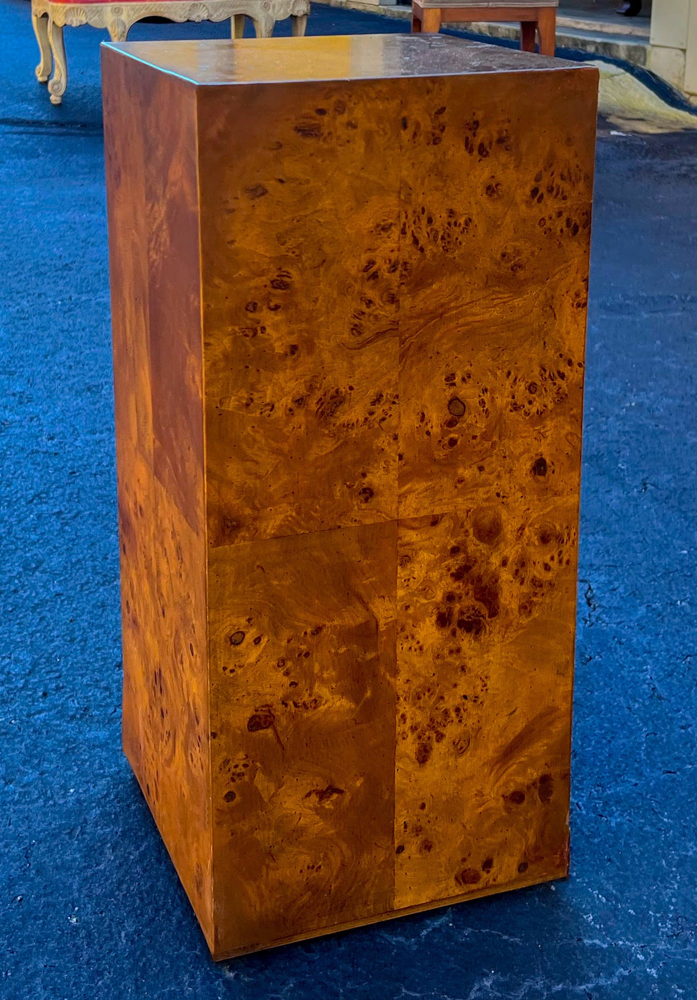 This is a 1970s Milo Baughman style burl wood pedestal in very good condition. It is unmarked. Perfect for displaying statuary or even as a side table.