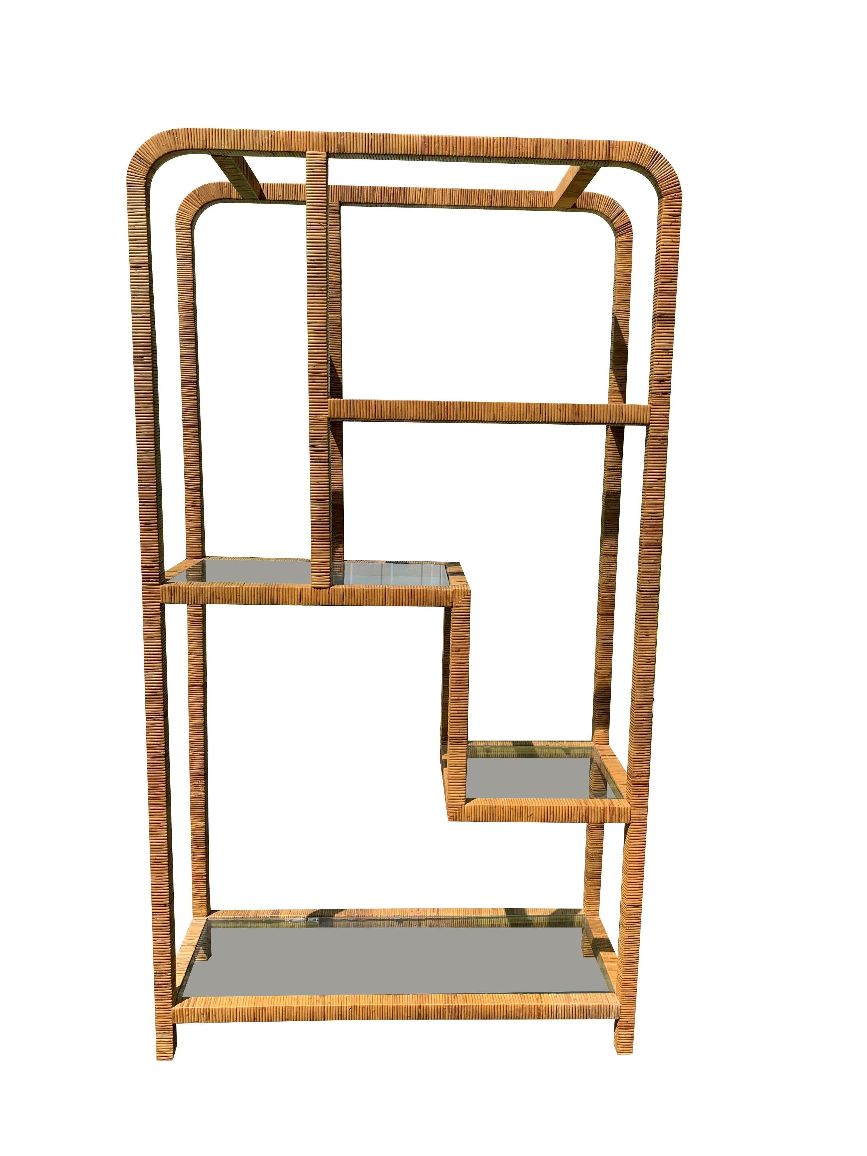 Vintage 1970s Milo Baughman Style Wicker Rattan Wrapped Etagere

This vintage etagere is a must-have for anyone looking to add a touch of retro style and functionality to their home. The unique design and high-quality materials make it a valuable