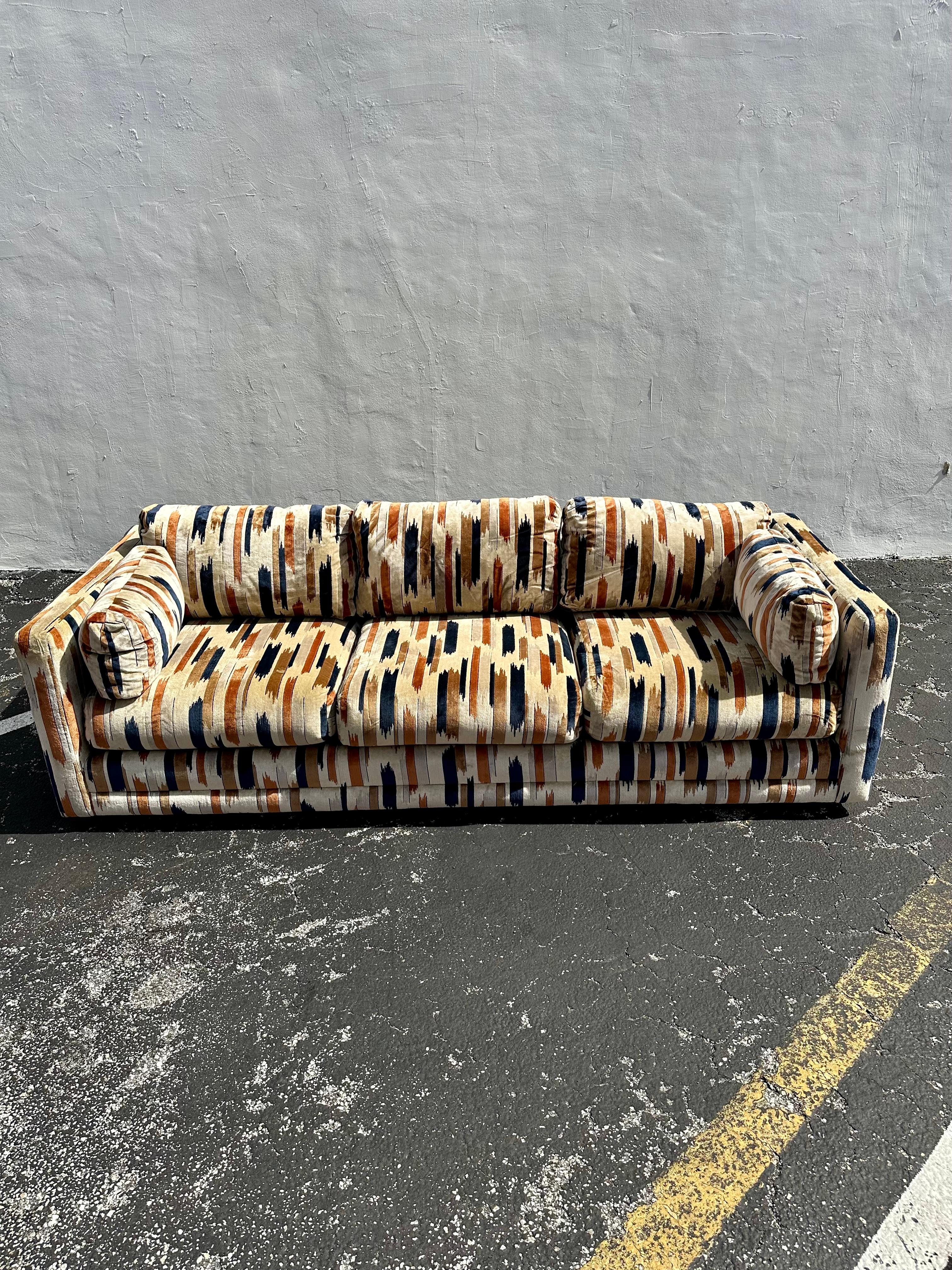 On offer on this occasion is one of the most desirable Baughman/Larsen, cotton velvet, tuexedo sofa you could hope to find. In colorations of navy blue, brown and beige. This is an ultra-rare opportunity to acquire what is the most spectacular and