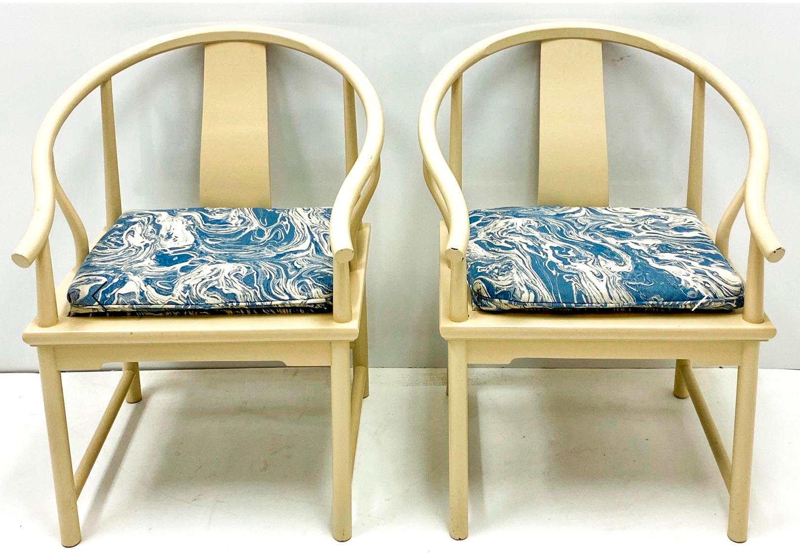 This is a vintage pair of Ming style arm chairs by Baker Furniture. The ivory lacquer is vintage, and the blue marbleized upholstery is new. They are marked and in very good condition.