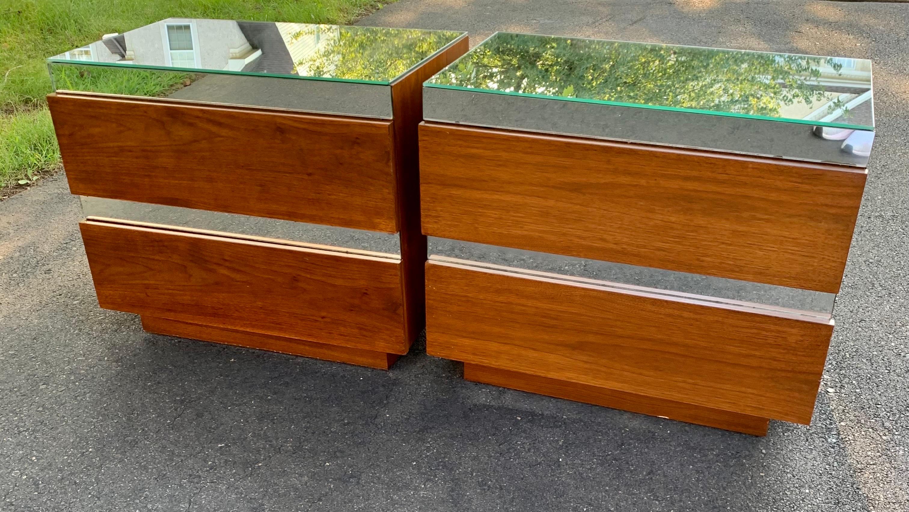 Unique post modern mirrored top and accented nightstands. Sleek design with two drawers.  Nice vintage condition with beautiful wood grain. Drawers slide smoothly. Super pretty pair.