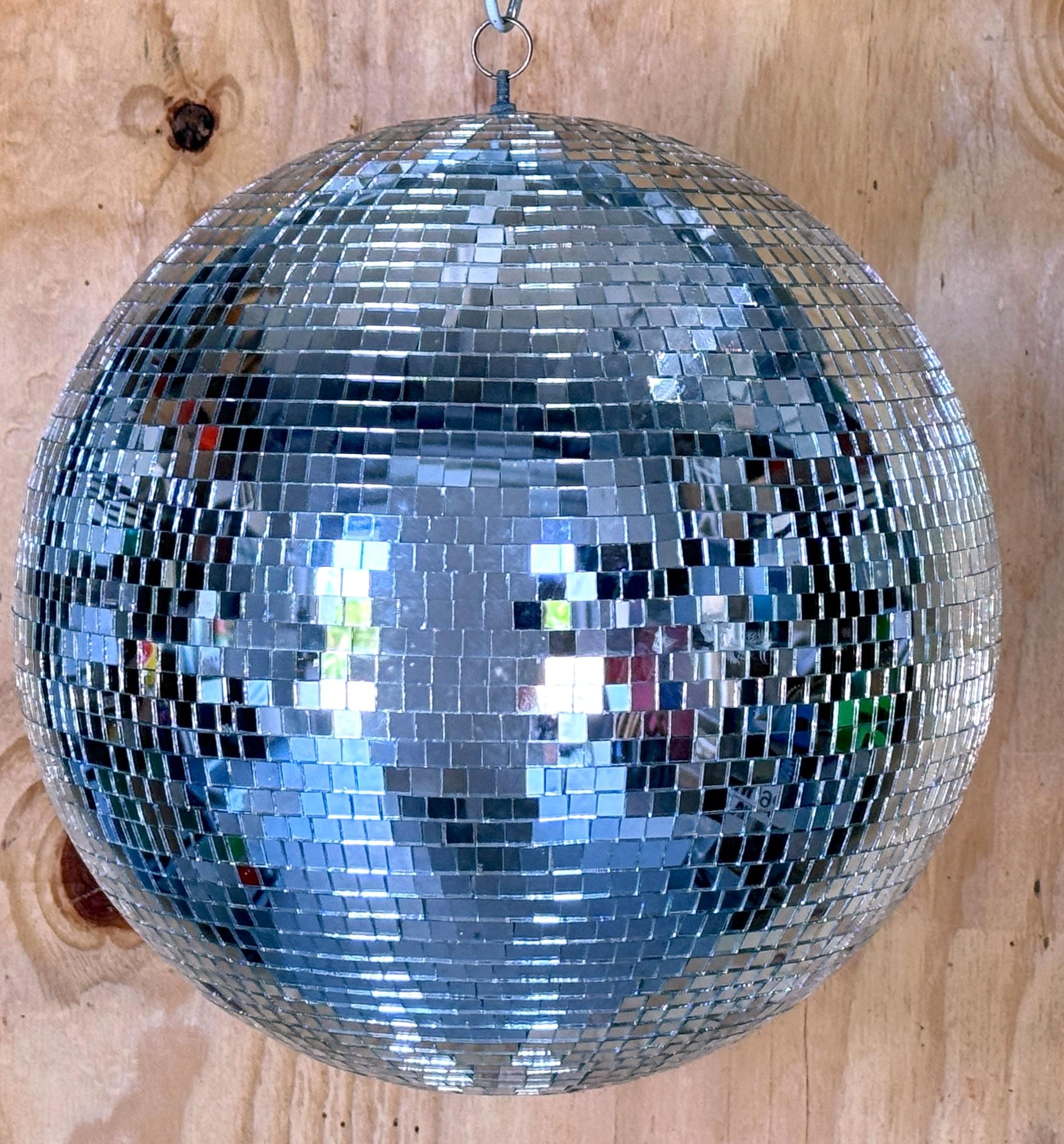 1970s Mirrored Disco Ball 
16-inch round x 18-inch high 
USA, Attributed to Omega National Products, Circa 1970s

A rare and iconic 1970s mirror disco ball, attributed to Omega National Products. Measuring 16 inches in diameter and 18 inches high,