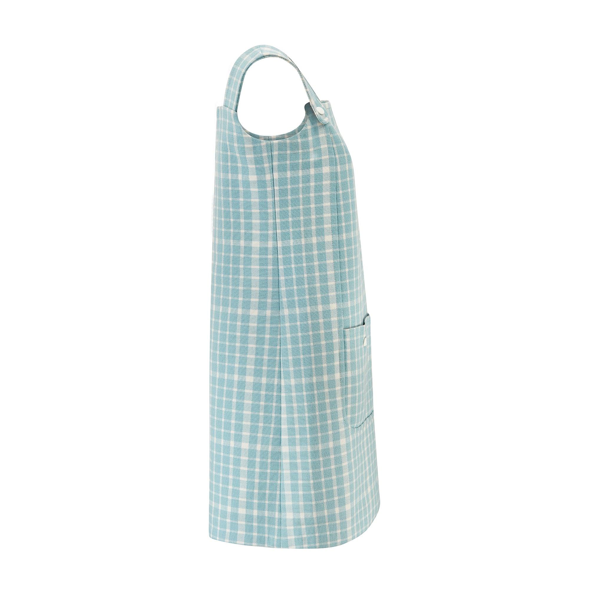 This tunic mini-dress, resplendent in pale blue gingham wool, was designed by Guiborgé for Miss Dior in the 1970s. Aimed at a younger audience than the Christian Dior Boutique collections, it has a playful, ingénue feel. The chunky straps form a