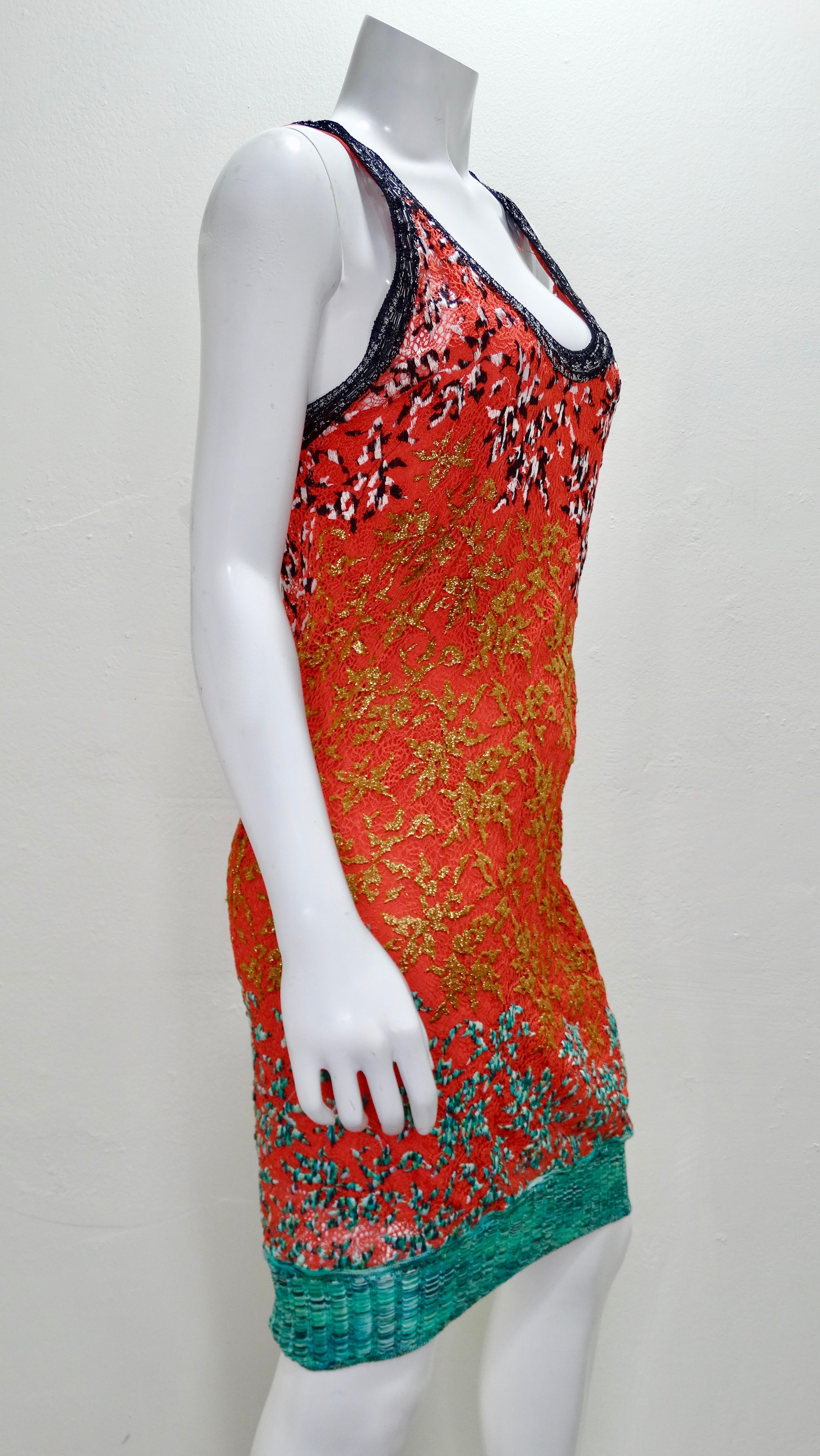 Searching For Some Missoni In Your Life? Look no further! This 1970's crochet Missoni dress features a multi-colored abstract motif all throughout with a signature Missoni hem. Scoop neckline, tank top straps and a coral colored slip underneath.