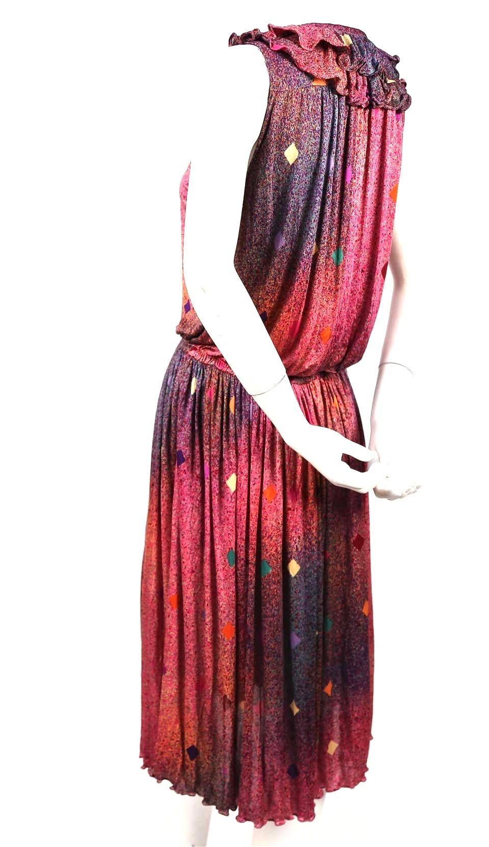 Brightly colored, printed, silk-jersey dress with ruffled neckline from Missoni dating to the late 1970's. Fits a size S or M. Approximate measurements: waist 27