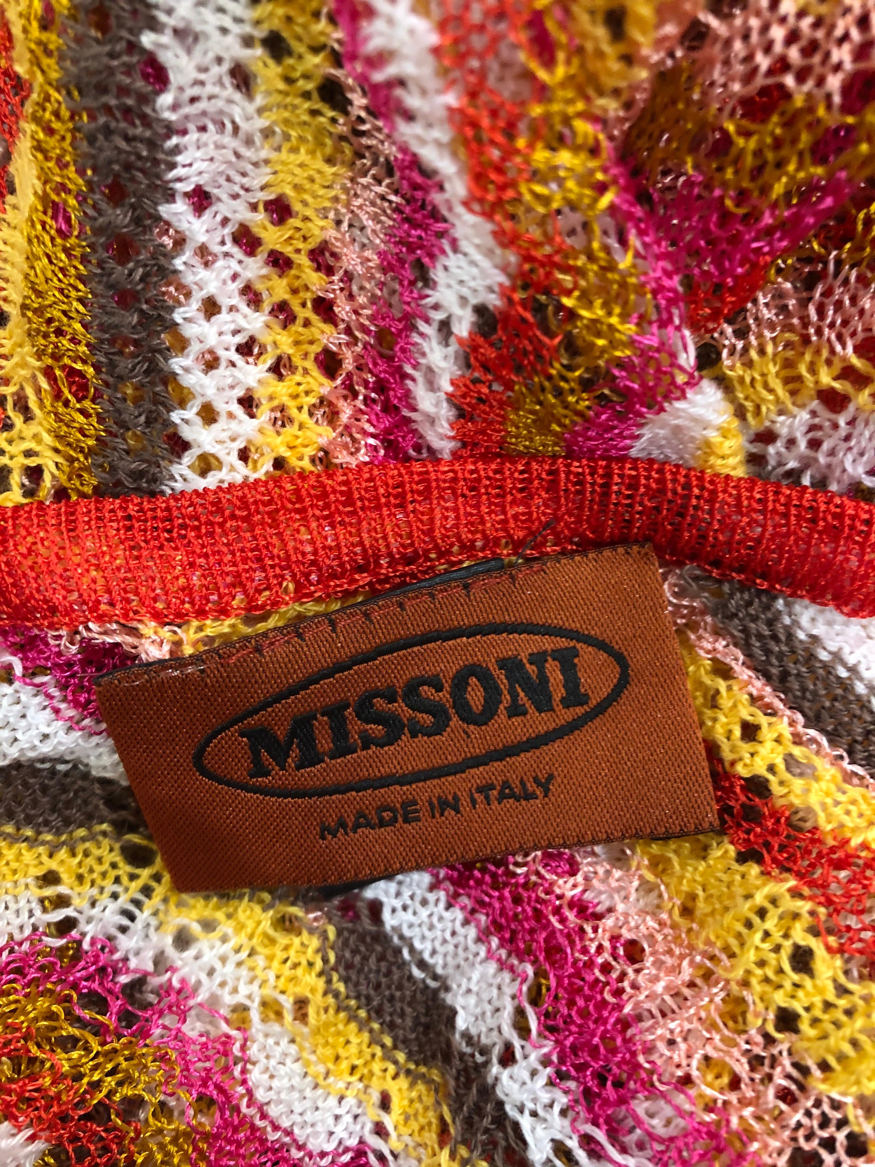 Chic late 1970s MISSONI orange label pink, orange, yellow and white crochet poncho! Features signature zig zag stripes. Simply slips over the head. Great alone, or layered with shorts, bell bottoms or a skirt. Also great over a swimsuit. In great