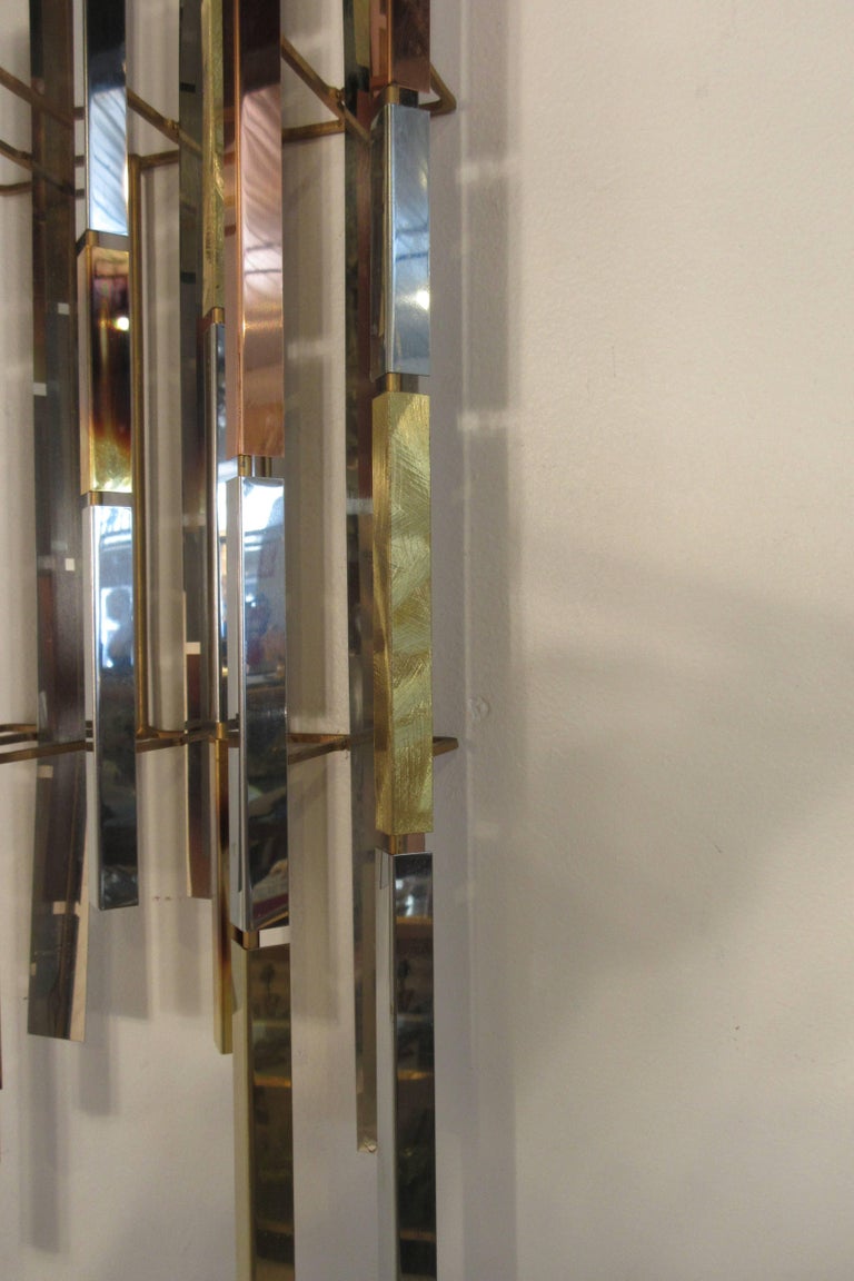 Pair Of 1970s Mixed Metal Wall Sculptures For Sale at 1stDibs