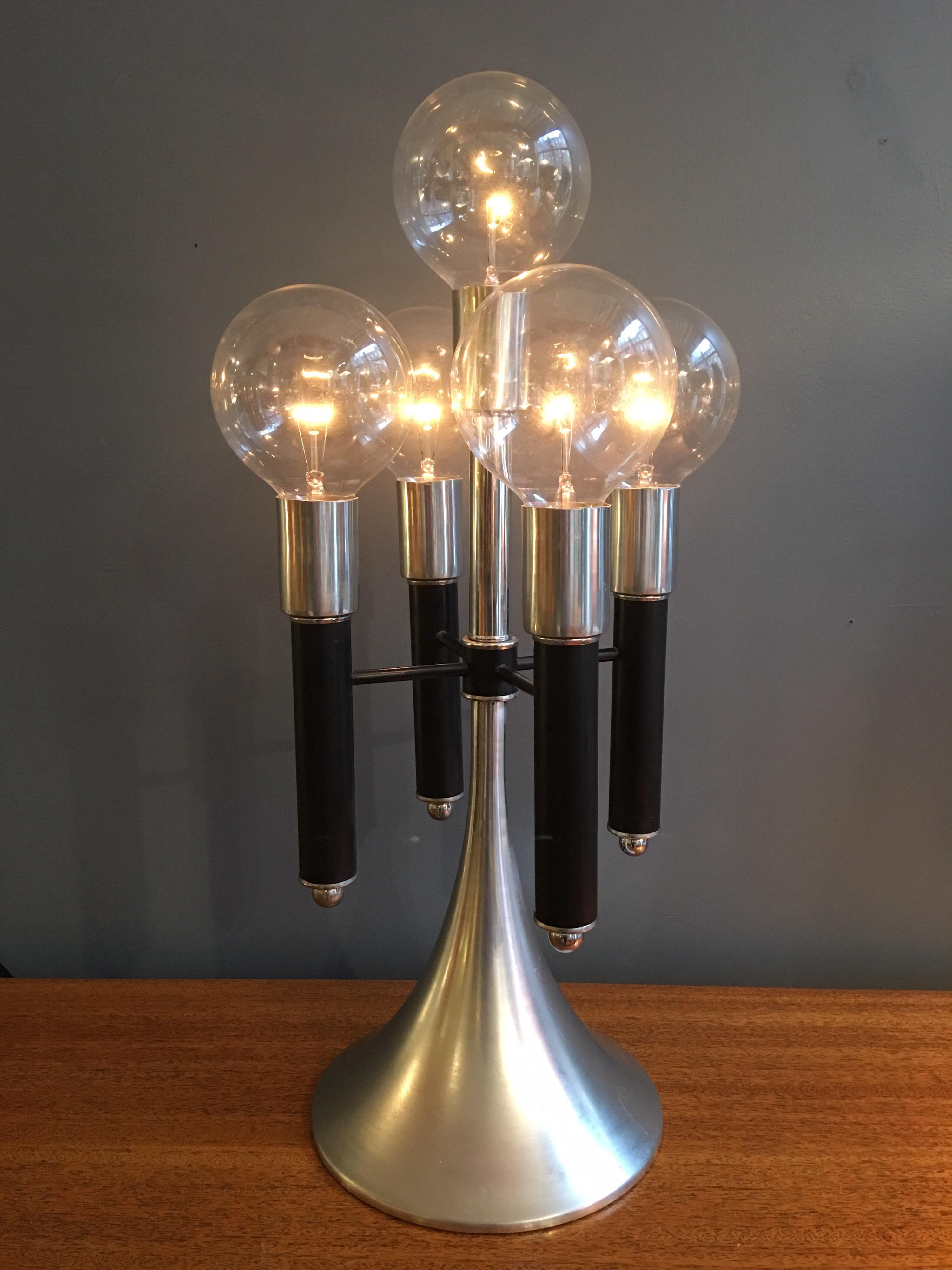 1970s Mod aluminum table lamp with 5 clear vanity bulbs. Round base that tapers up to 5 stems. On off switch with built in dimmer.