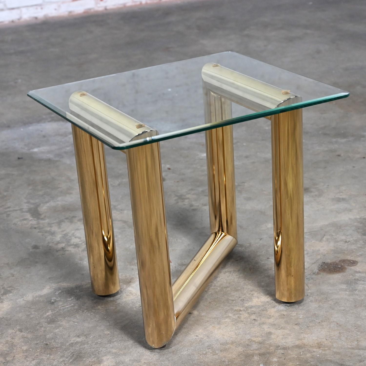 Gorgeous vintage modern brass plated end or side table with square beveled glass top in the style of Karl Springer. Beautiful condition, keeping in mind that this is vintage and not new so will have signs of use and wear even if it has been