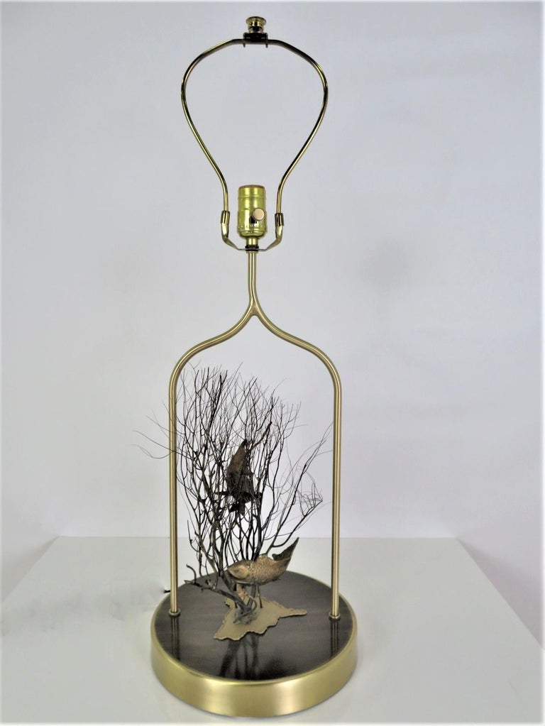 From the 1970s unusual brass table lamp featuring fish with natural coral sea fan. Rewired and with new 3 way socket (outside brass cover original). Brass throughout re-polished (fish and their environment original condition). On/Off switch on cord.