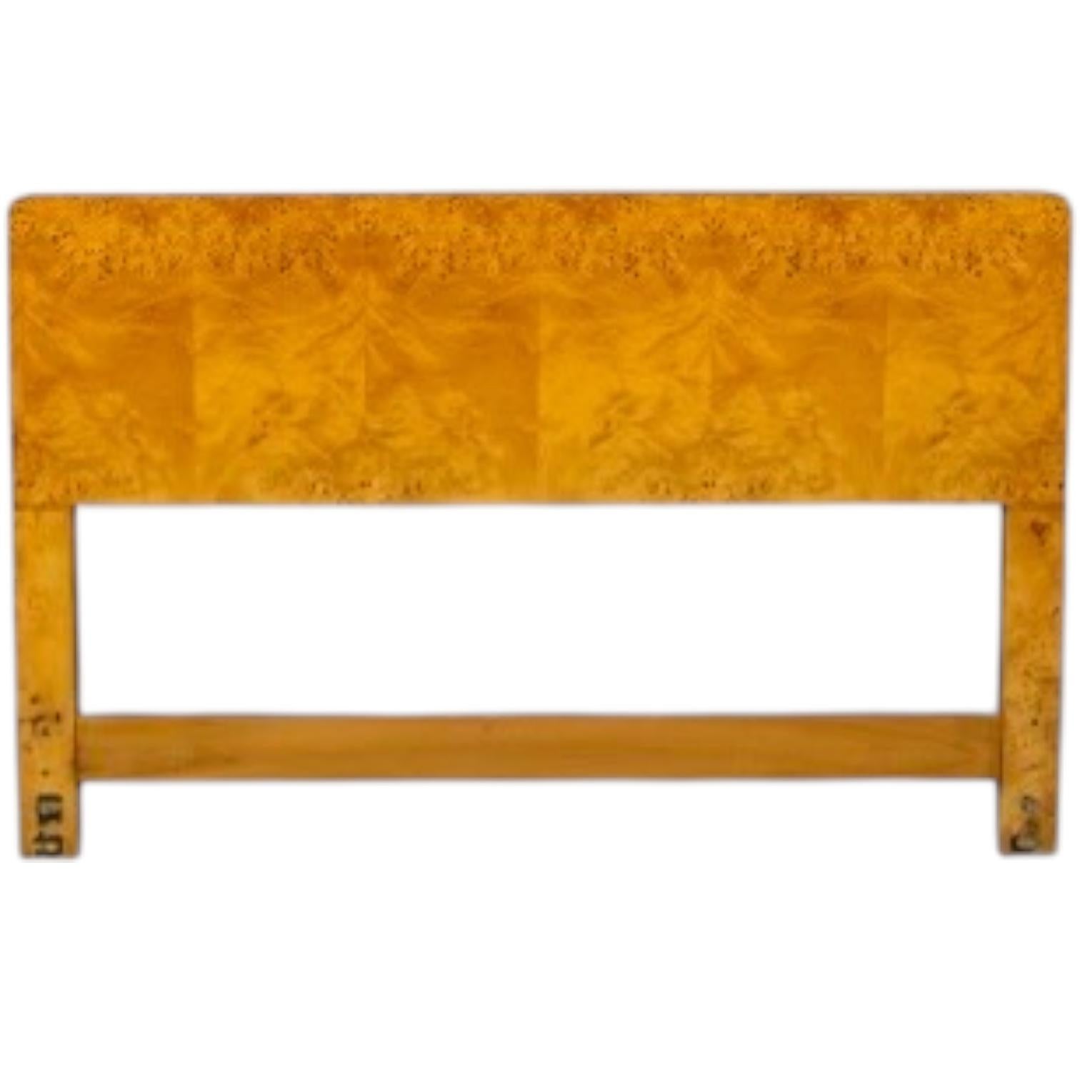 This is a modern burlwood headboard attributed to John Widdicomb. It is a queen size headboard and is in very good condition. It is unmarked. 