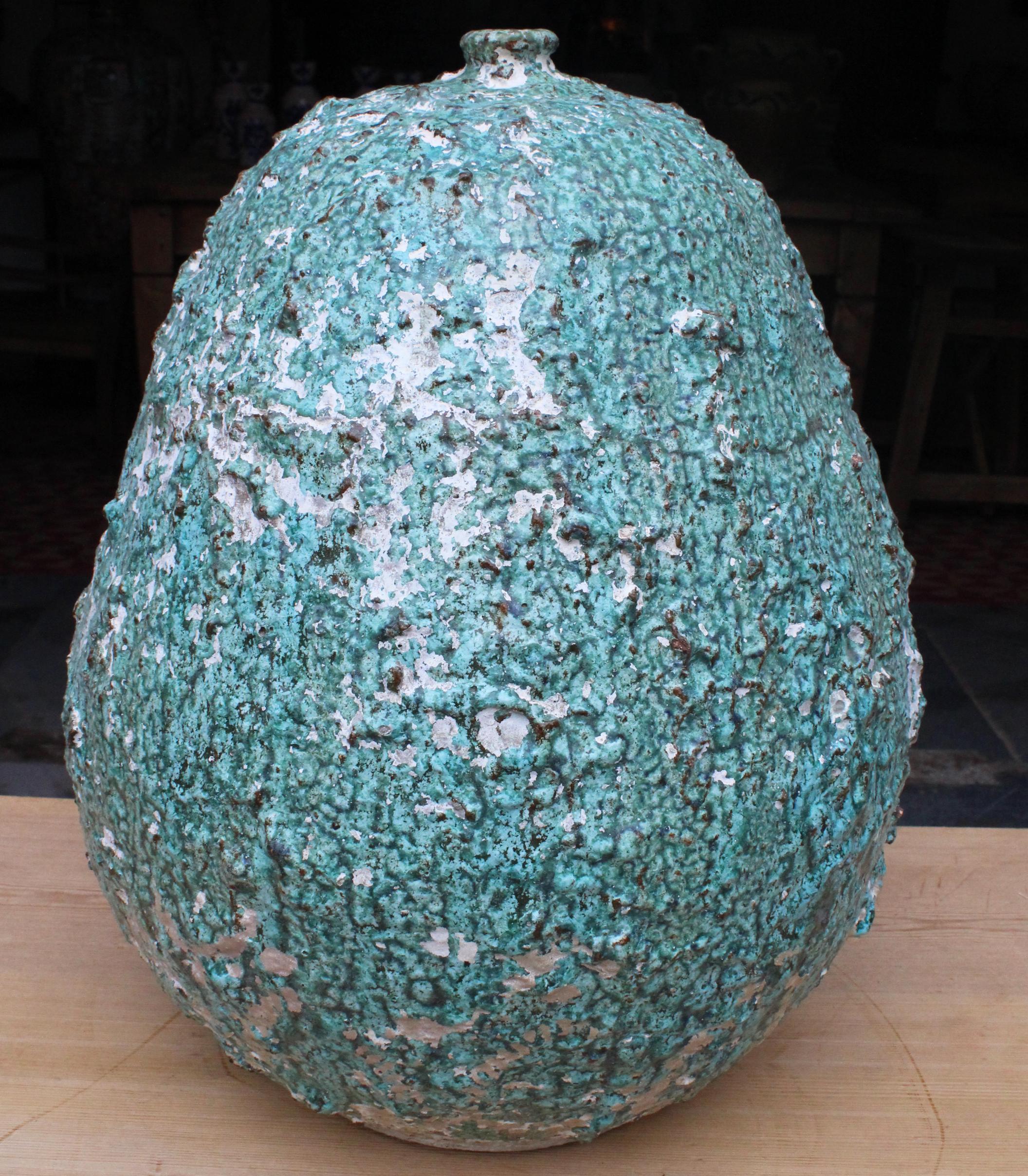 1970s modern ceramic art vase signed by Eimers F. It has a deep organic feel thanks to the rough finish and splashes of white over turquoise.

 