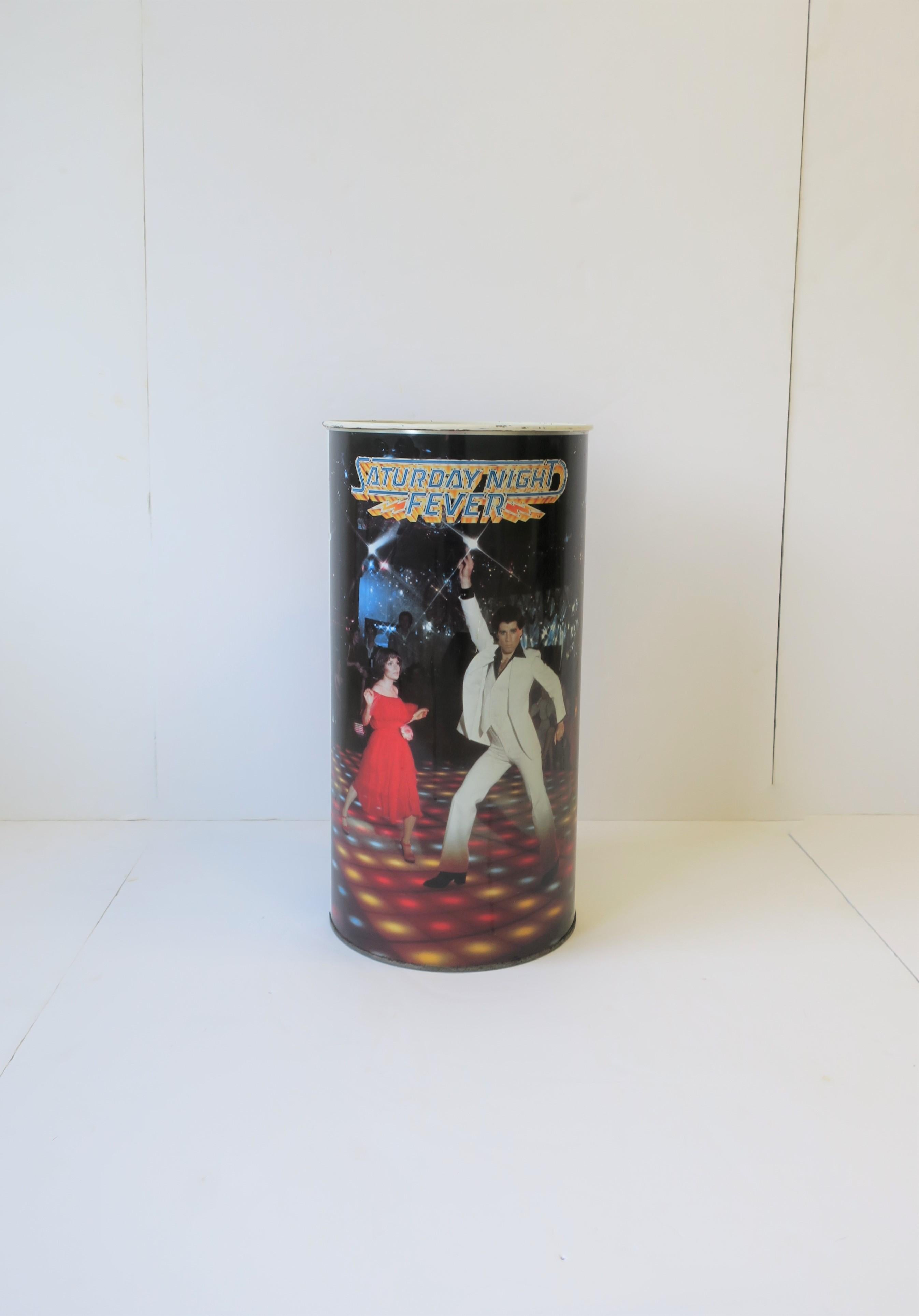 A 1970s modern wastebasket [waste basket], trash can, or umbrella stand. Piece, circa 1977 disco era, features John Travolta and Karen Lynn Gorney, from the iconic movie 'Saturday Night Fever', in the heart of Brooklyn, New York.

Measures: 19