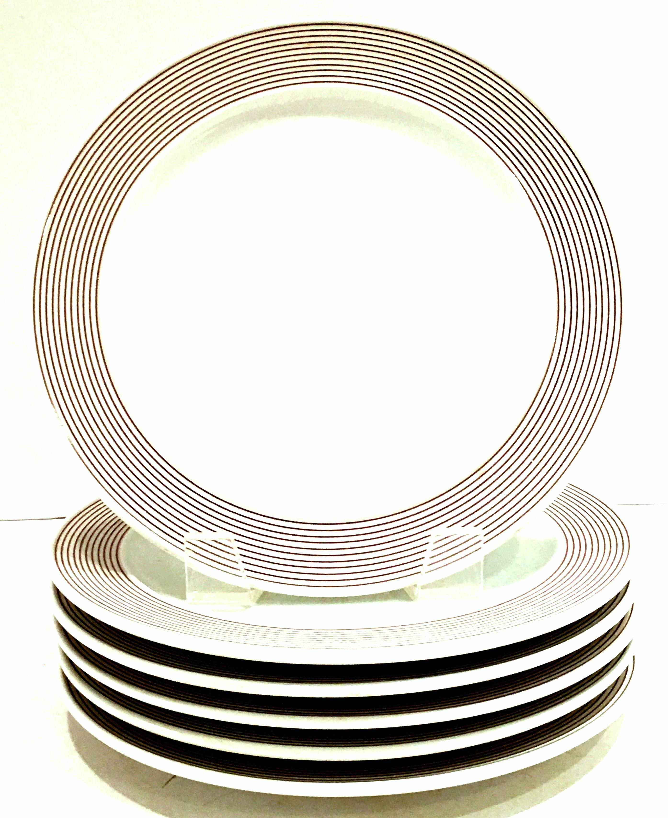 1970's Modern German porcelain dinnerware ‘Joy One’ set of 20 by, Rosenthal. Pattern features a modern and clean lined white ground with brown rings/stripes detail.
Set includes, 4 dinner plates, 10.5 diameter, 6 bread/butter plates, 6.50