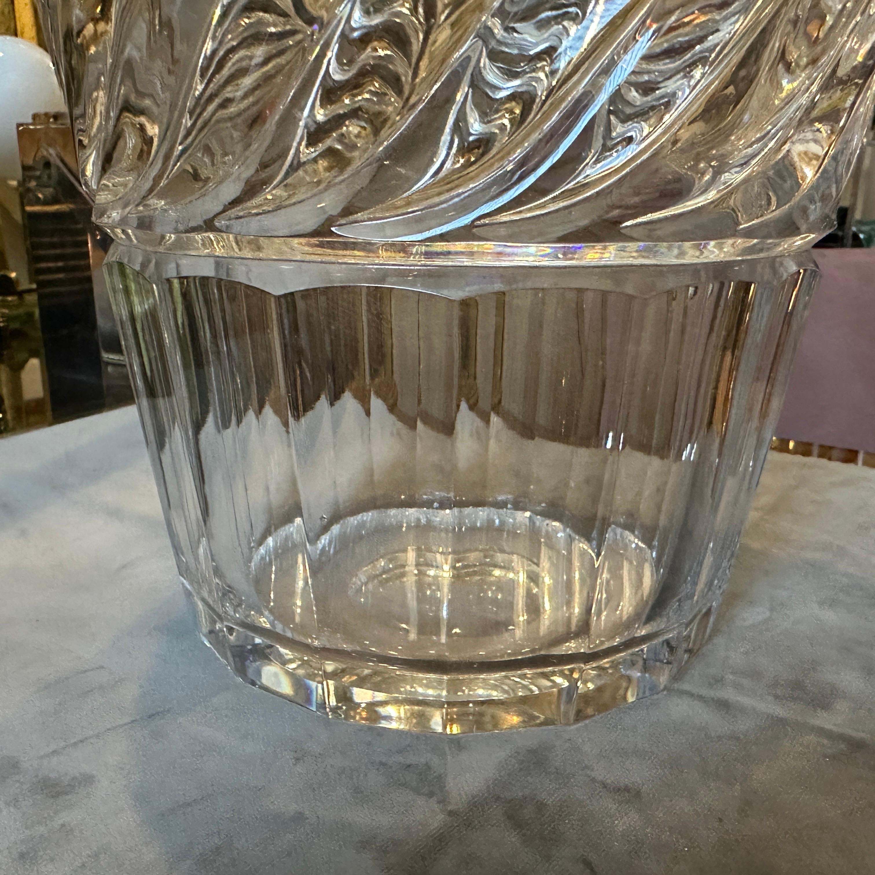 This 1970s heavy crystal Italian wine cooler is a striking piece that exudes sophistication and timeless elegance. Crafted from high-quality, thick crystal, this wine cooler showcases a combination of sleek lines and intricate details that reflect