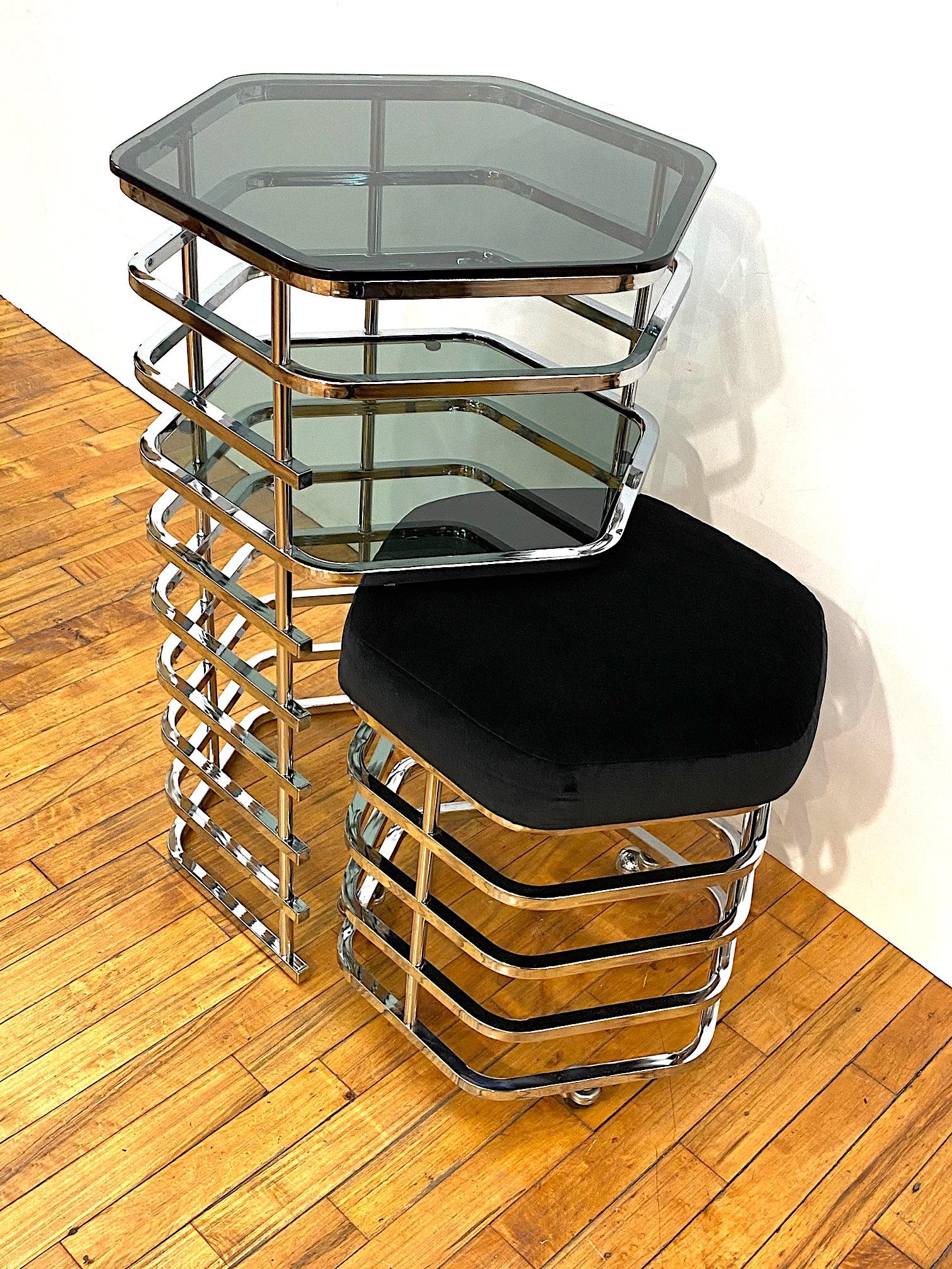 A wonderful midcentury Italian vanity table and stool set from the 1970s. Architectural in the design of a column of ten tiers of chrome bars. Each tier is supported by small round chrome rods allowing for an open and light appearance. The stool has