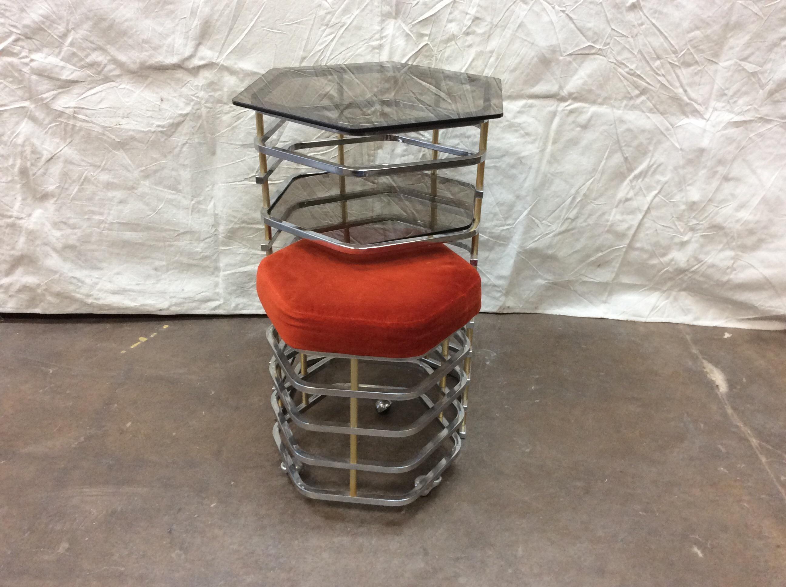 A wonderful midcentury Italian vanity table and stool set from the 1970s. Architectural in the design of a column of eleven tiers of chrome bars. Each tier is supported by small round brass rods allowing for an open and light appearance. The stool