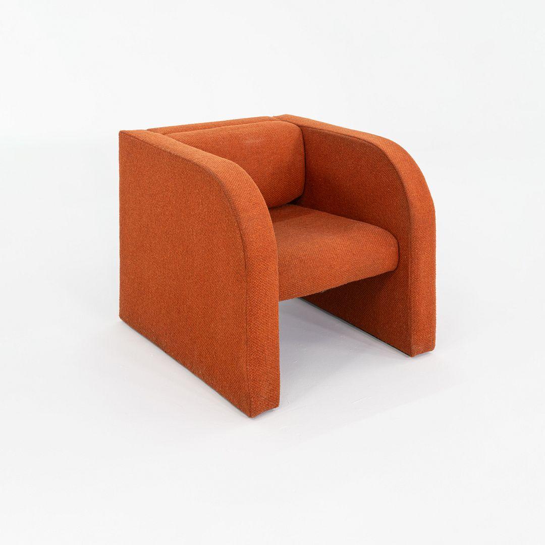 This is a Custom Lounge Chair in Dark Orange Hopsack Fabric, dating to the 1970s. It came to us from a home in Ithaca, New York. The silhouette echoes the designs of Pierre Paulin, but there are no tags to indicate the maker. We have three pieces