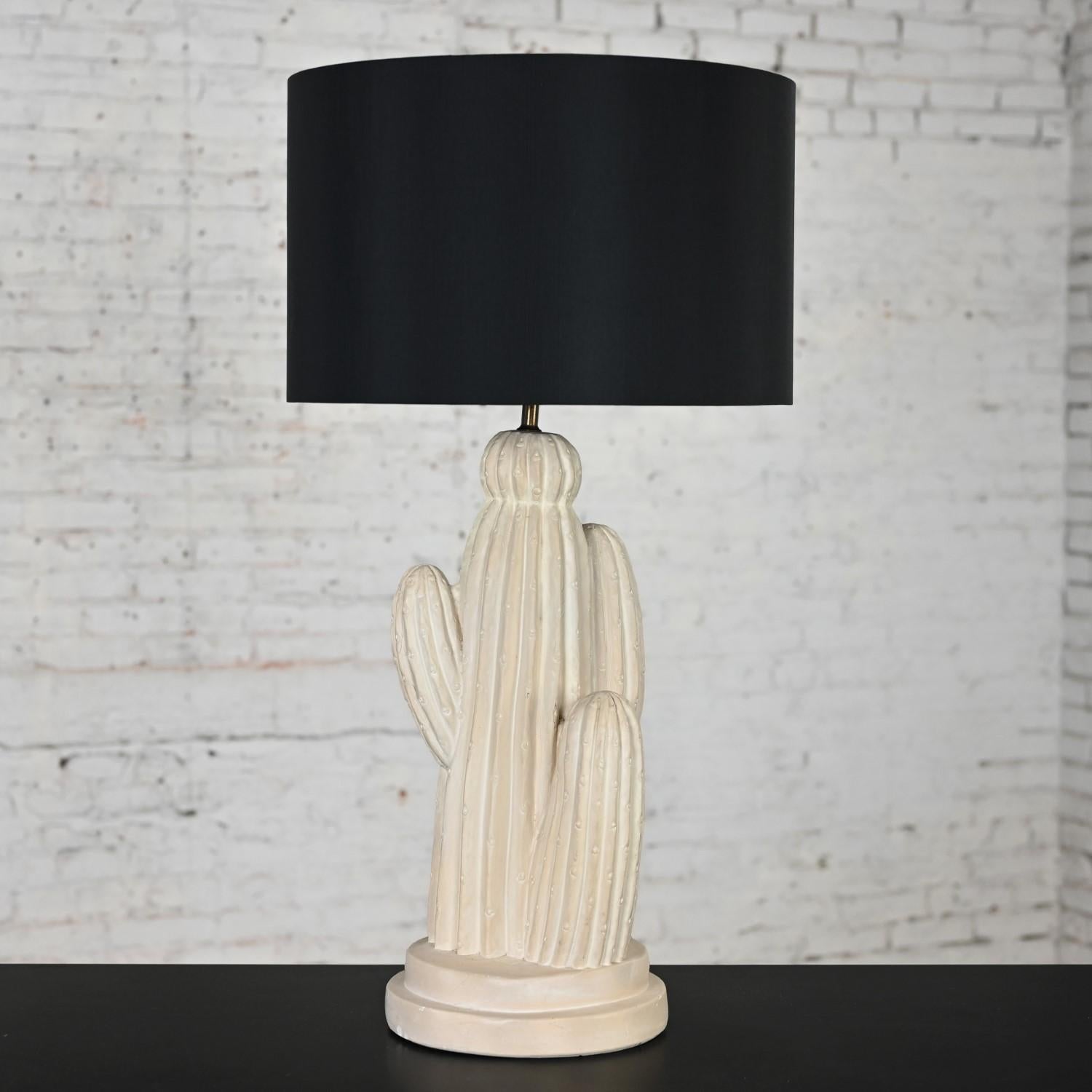 Handsome vintage Modern plaster cactus large scale cactus table lamp with a brass shaft, 3 way switch, and a new black silk-like drum shade. Beautiful condition, keeping in mind that this is vintage and not new so will have signs of use and wear