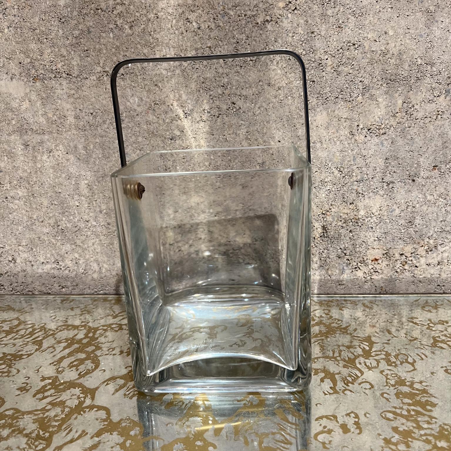 
Crystal Glass Ice Bucket Silver Plate Handle
Square shape with curve around edges.
Clean modern lines
Unmarked.
Attributed design style Cristal de Sèvres
10.25 to top, 7 h to glass x 5.5 x 5.5   
Original vintage condition unrestored
Handle appears