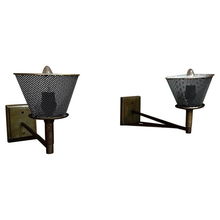 1970s Patinated Bronze Arm Wall Sconce Lamps with Modern Perforated Shade
Unmarked.
Set of two.
Original restored vintage preowned condition.
Upgraded brass shade, rewired and new socket.
9.5 tall x 6.25 w x 18 d
Refer to images provided please.