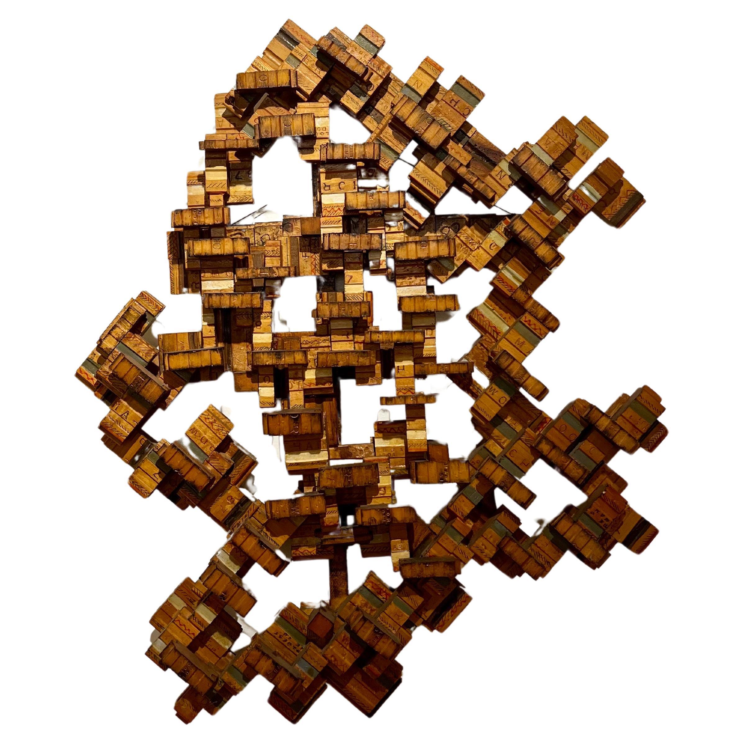 One-of-a-kind wood handcrafted wall art sculpture Fragmented pieces of wood put together in an abstract freeform shape, circa 1970's.
