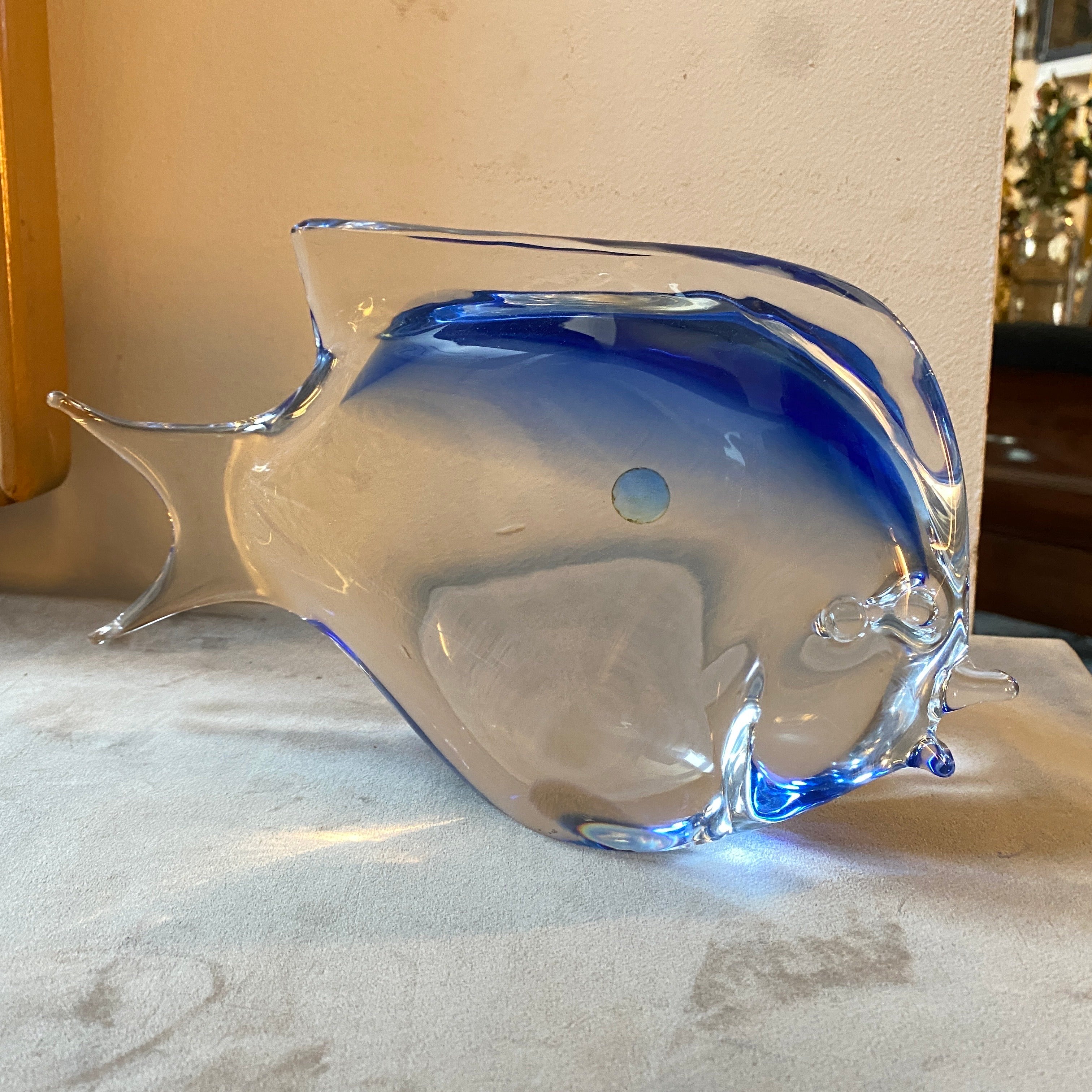 A blue sommerso murano glass modernist figure of a tropical fish manufactured in Murano in the Seventies. It's in perfect conditions and labeled on a side made in Italy Murano. It's a stunning and artistic decorative piece that showcases the