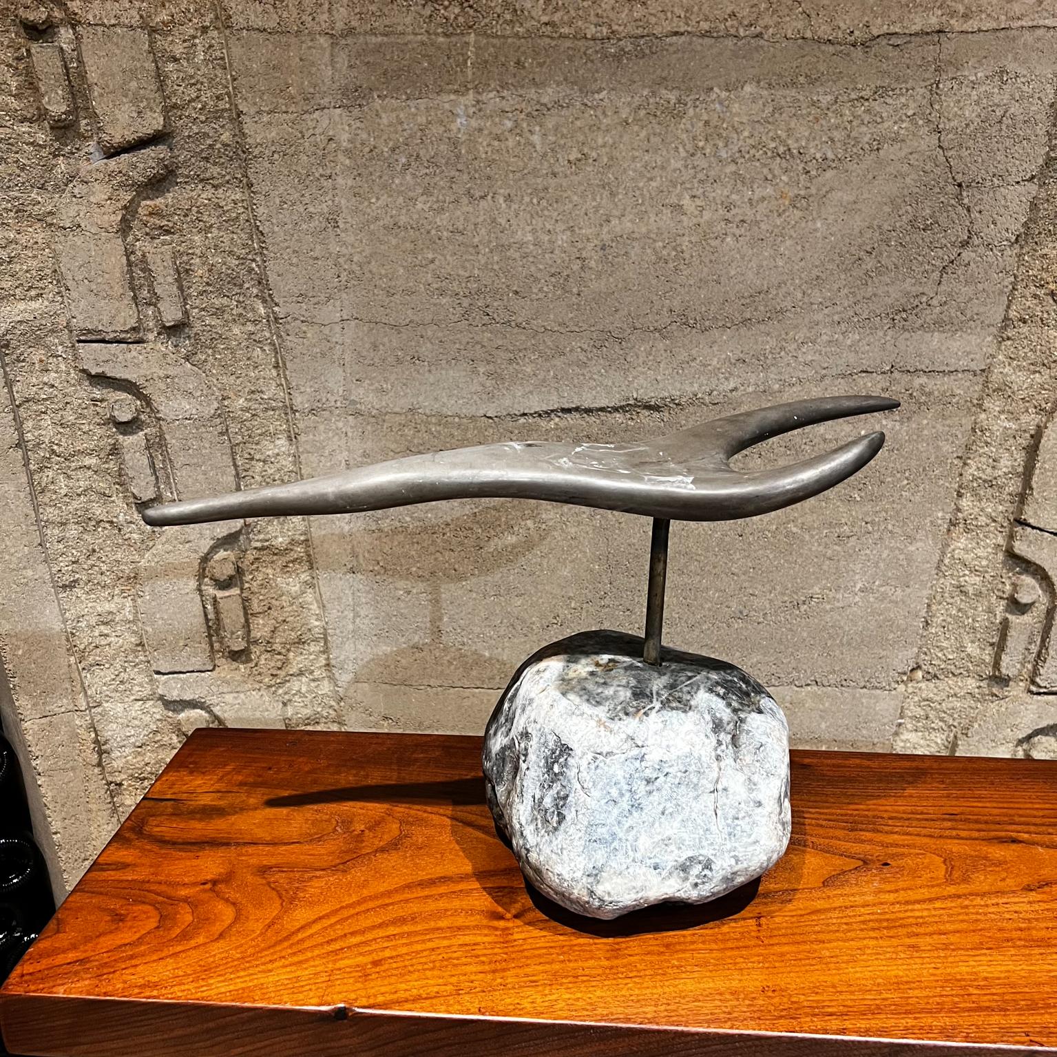 1970s Modernist bronze and stone abstract table sculpture
Organic Modern form.
Stone base- rock mount.
Vintage patina. 
No signature present from the maker.
11.75 tall x 7.75 w x 21.25 long
Preowned condition original vintage