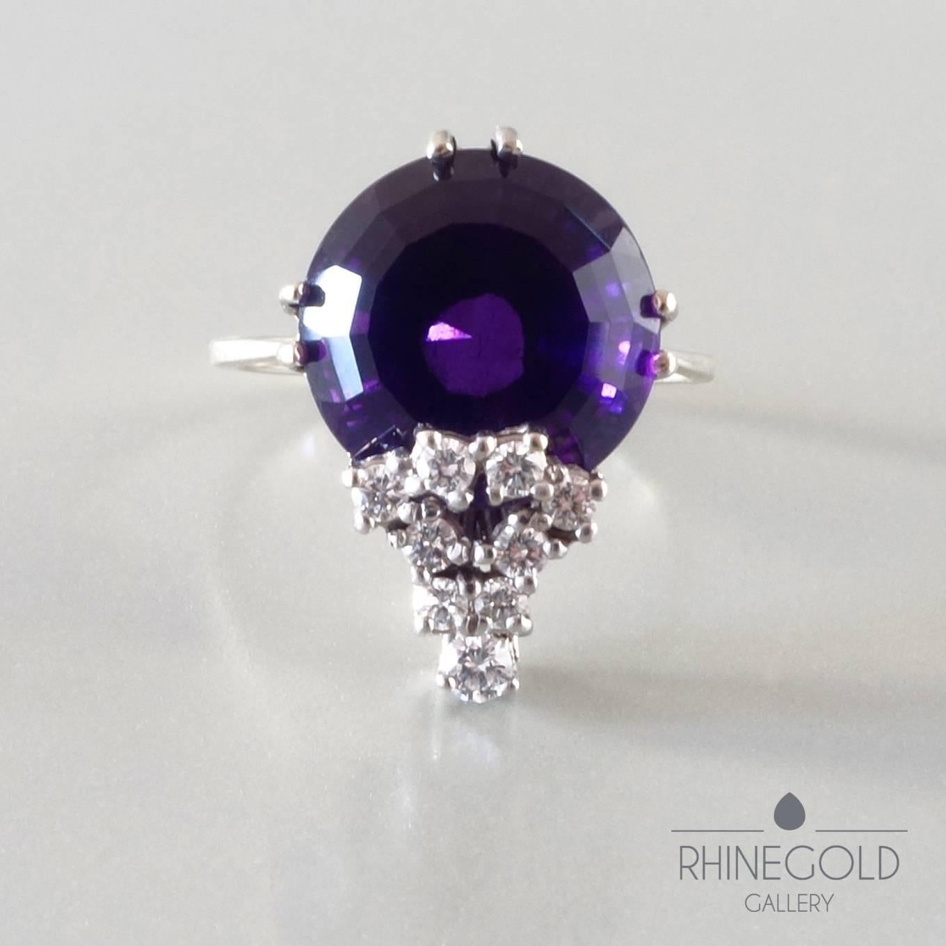 1970s Modernist Diamond Amethyst White Gold Cocktail Ring 
14k white gold, amethyst (approx. 6 ct.), brilliant cut diamonds (top wesselton, vvs-vs, ca. 0.3 ct. in total)
Ring head 1.9 cm by 1.35 cm (approx. 3/4” by 1/2”); Ø of amethyst 12
Ring size: