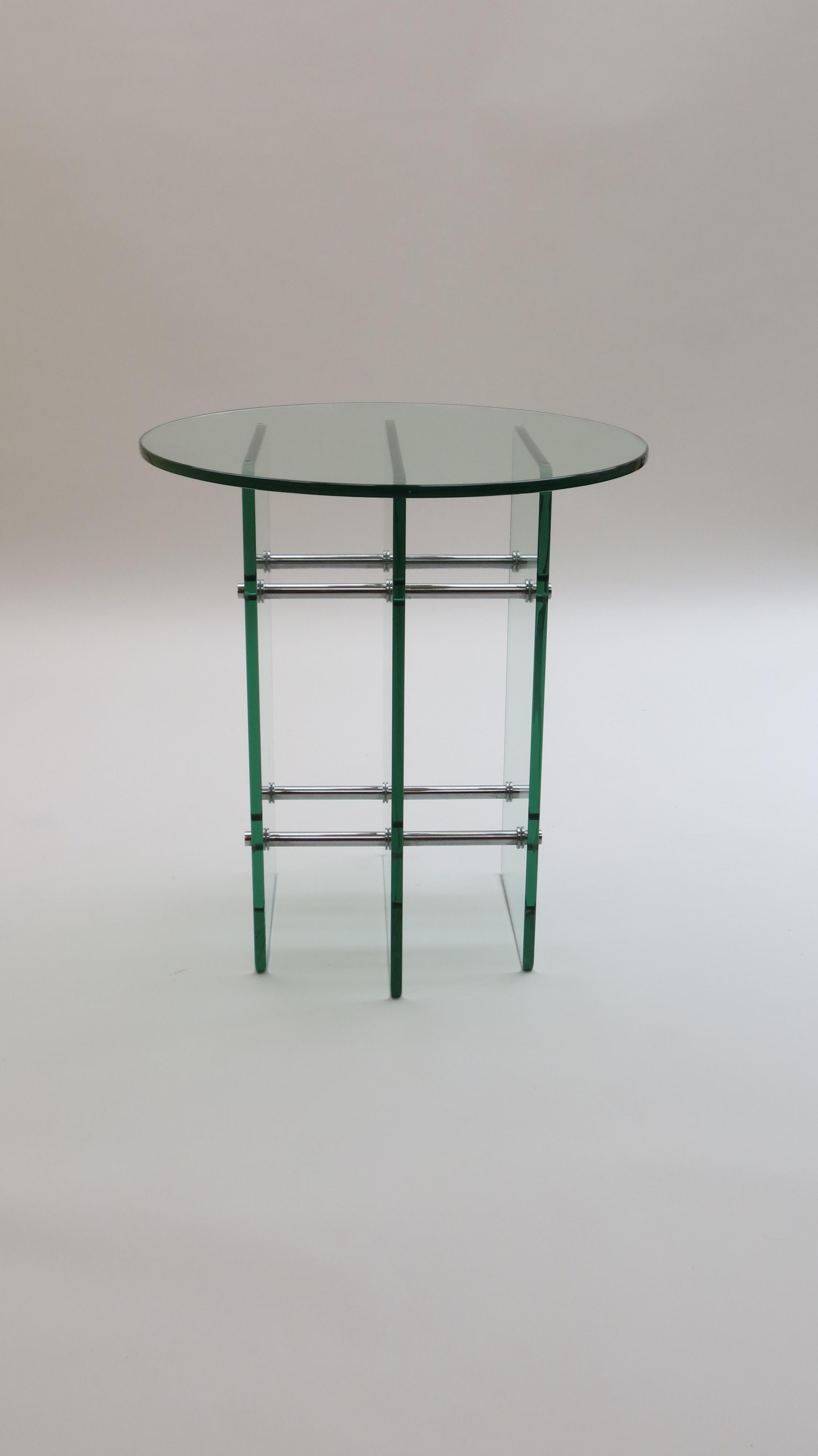 An exceptional quality glass side table. Made from thick tinted glass base and separate glass table top. The base is held with good quality nickel plated steel rods. The table is probably Swiss origin and dates from the 1970s.

    