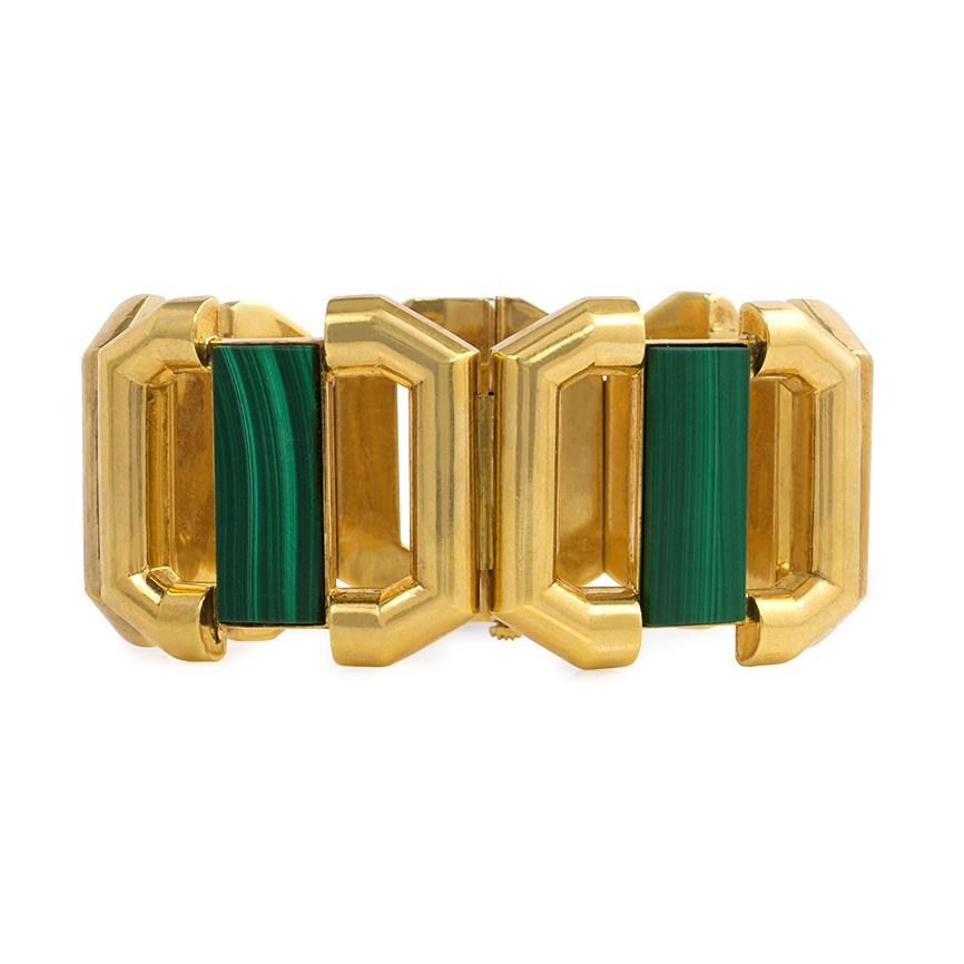 A gold bracelet in the Modernist style comprised of open octagonal links centering on bars of rectangular malachite, in 18k.