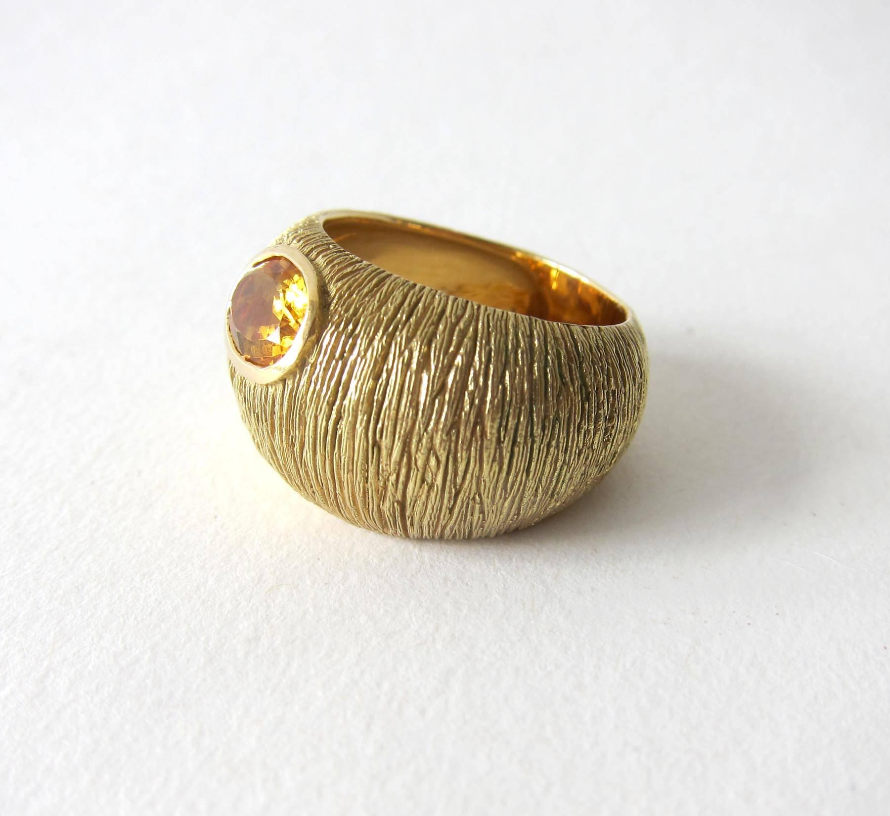 Textured 18k gold with faceted oval citrine stone ring circa 1970's.  Ring is a finger size 9 - 9.25 due to its unusual shape.  Signed 18k on inside shank and in very good vintage condition.  14.8 grams