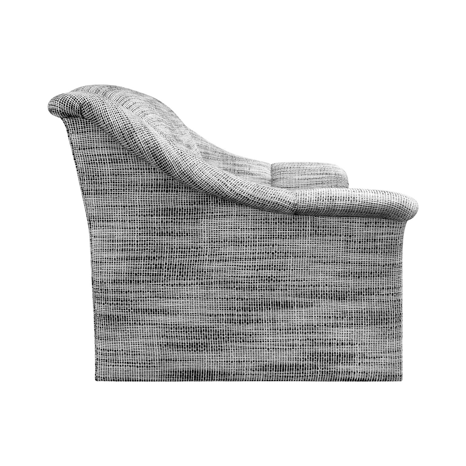 Modernist lounge chair in black and white wool basketweave upholstery. USA, 1970s.