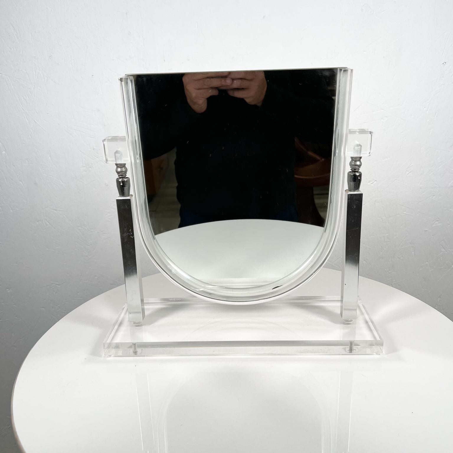 1970s Modernist Lucite Chrome vanity table mirror
in the style of Charles Hollis Jones.
Measures: 13.88 tall x 14.13 wide x 5 deep.
Preowned original vintage condition.
See images provided please.
 