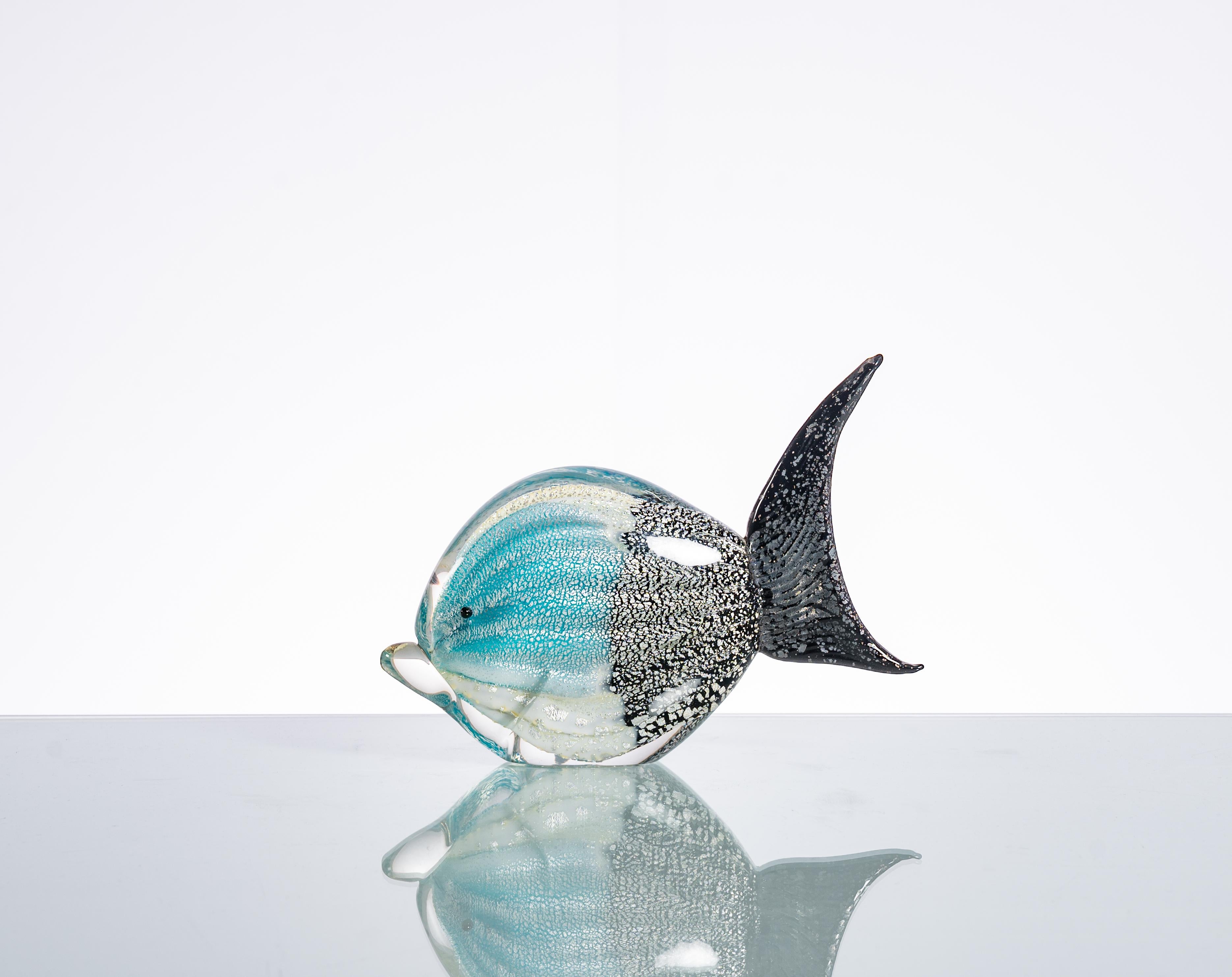 This Murano Glass Figure of a Tropical Fish is a stunning and iconic piece of art that embodies the artistic spirit of the era. Murano glass, hailing from the famous glassblowing island of Murano in Venice, Italy, is renowned for its exquisite