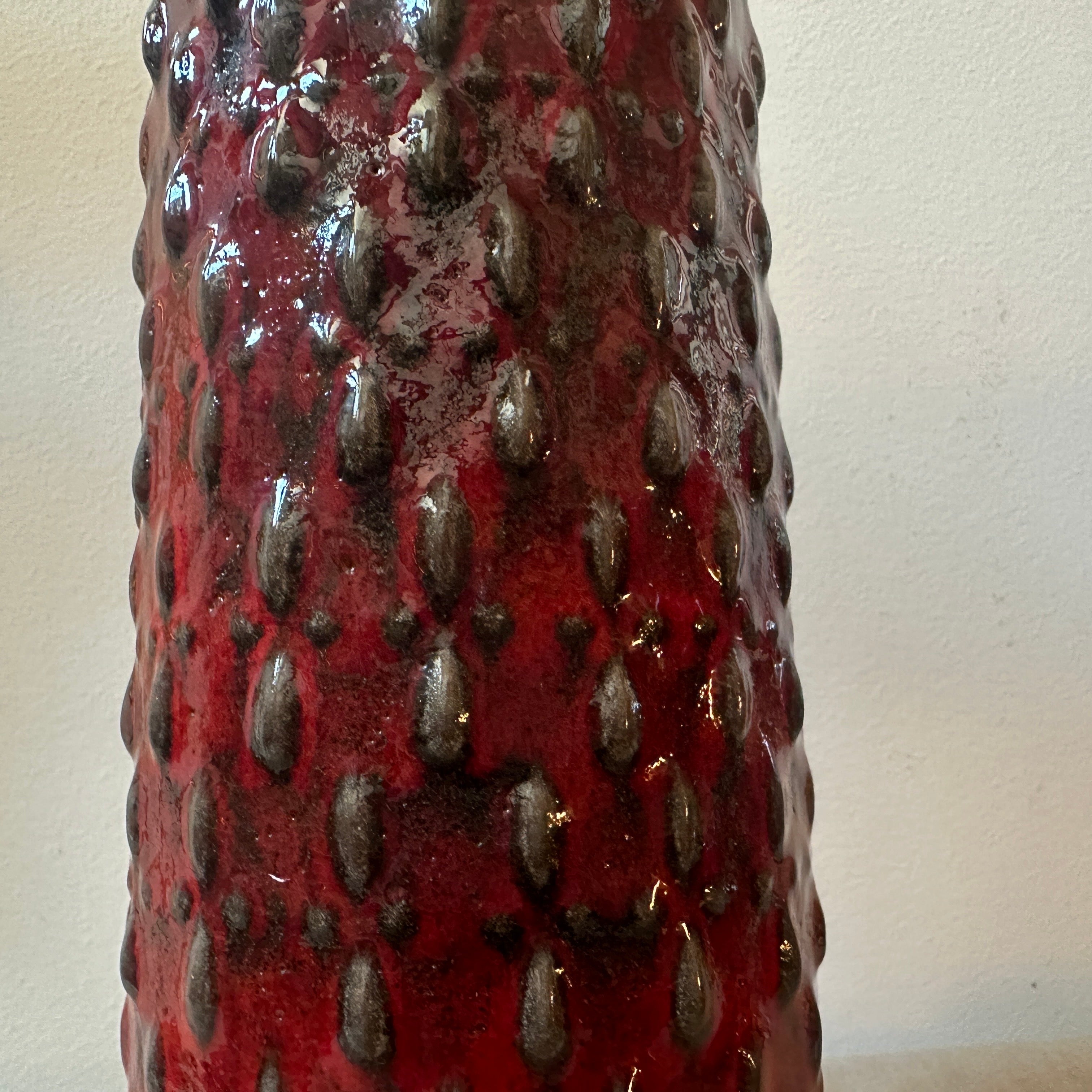 A fat lava ceramic vase manufactured in germany in the Seventies by WGP, it's in lovely conditions. The vase is a striking and unique piece of art and design, it embodies the bold and dynamic aesthetics of 1970s Modernist design, particularly the