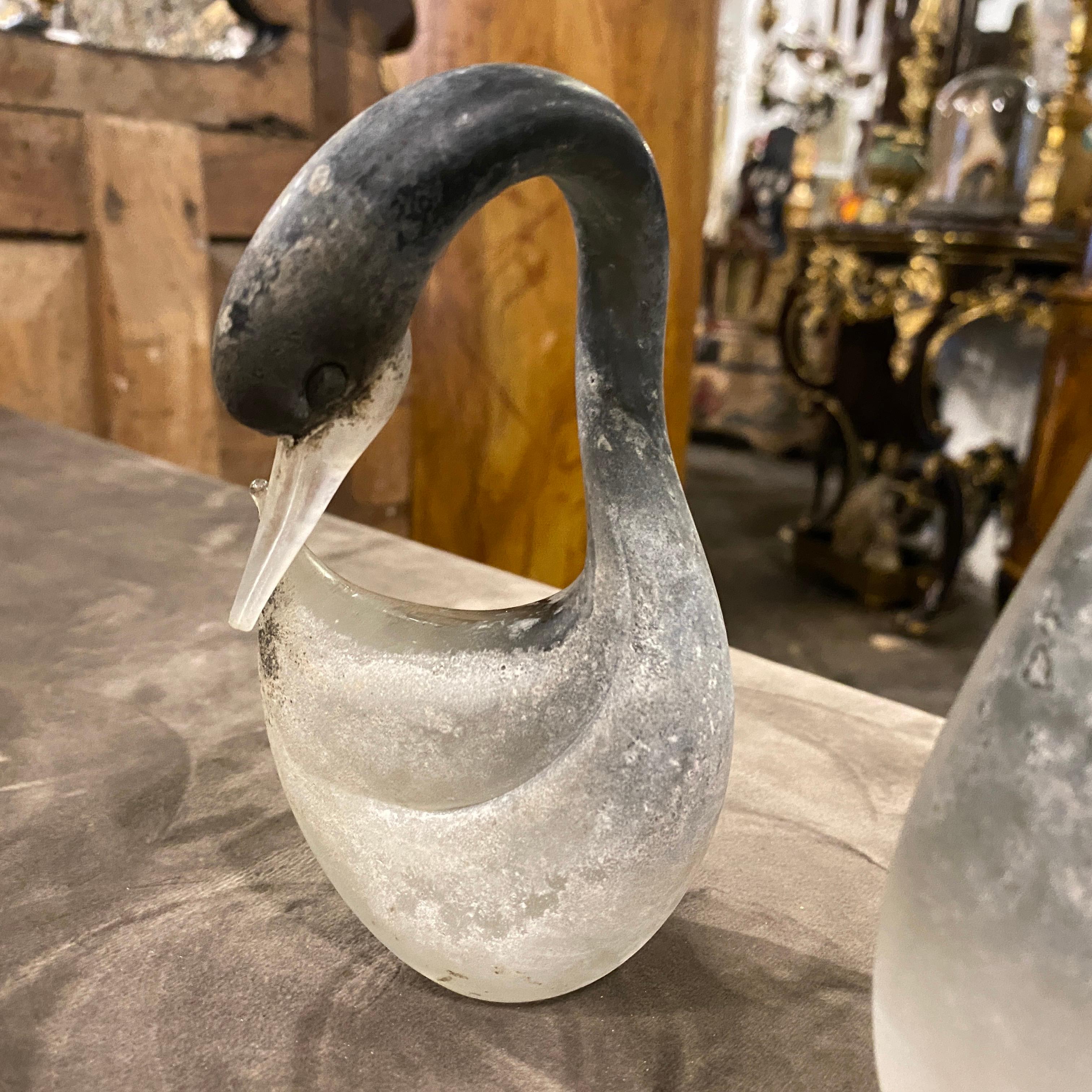 Two sculptures of swans in scavo murano glass by Cenedese, they are in perfect conditions, they are acid signed on the bottom cenedese, the small one has an height of 14 cm.