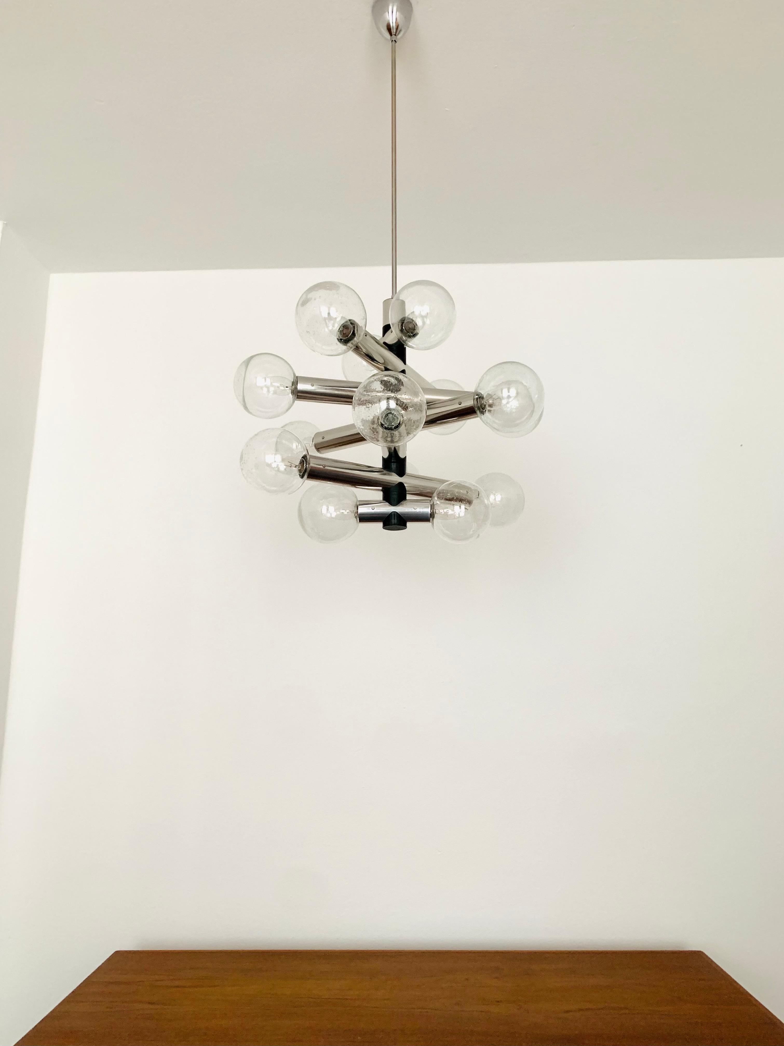 Very impressive Sputnik chandelier from the 1970s.
Exceptional design and very high-quality workmanship.
The lamp is a highlight for every room.
A particularly sparkling light is created.

Manufacturer: Kalmar
Design: J.T. Kalmar
Around