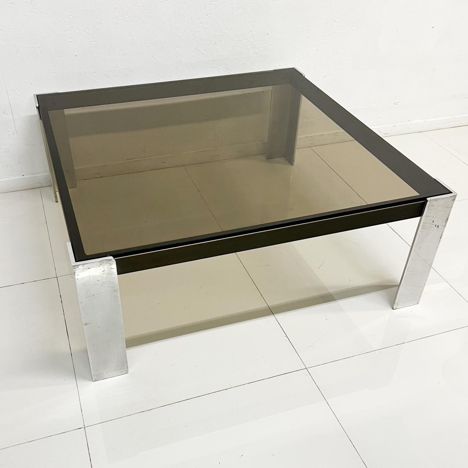 1970s Modernist Square Aluminum Coffee Table Style of Milo Baughman
Unmarked
15.5 tall x 39.88 x 39.88
Original unrestored vintage condition.
Delivery to LA OC Palm Springs
Please see images provided.
We have listed matching Console Table.
 
