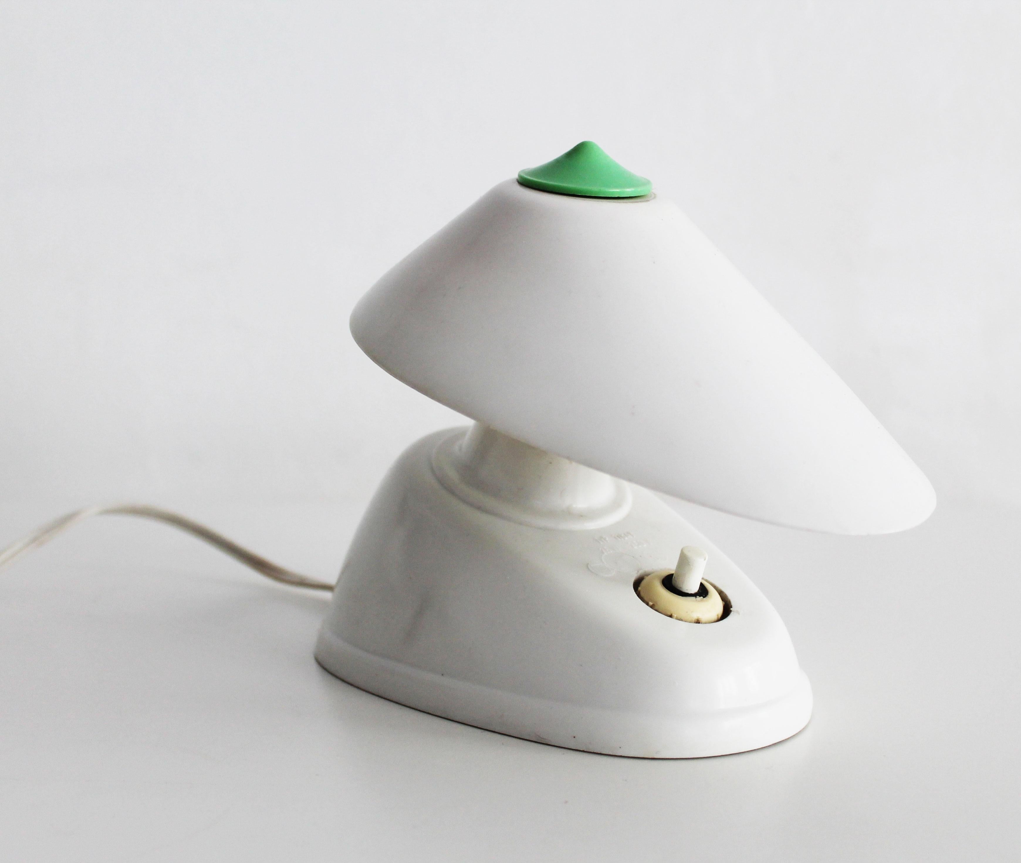 This is an original piece produced by Eletroskvit Nove Zamky in former Czechoslovakia. This lamp is made of white bakelite and can be hang as wall light or simply used as a desk lamp.  Due to it’s strong inspiration of a pre-war modernist aesthetic,